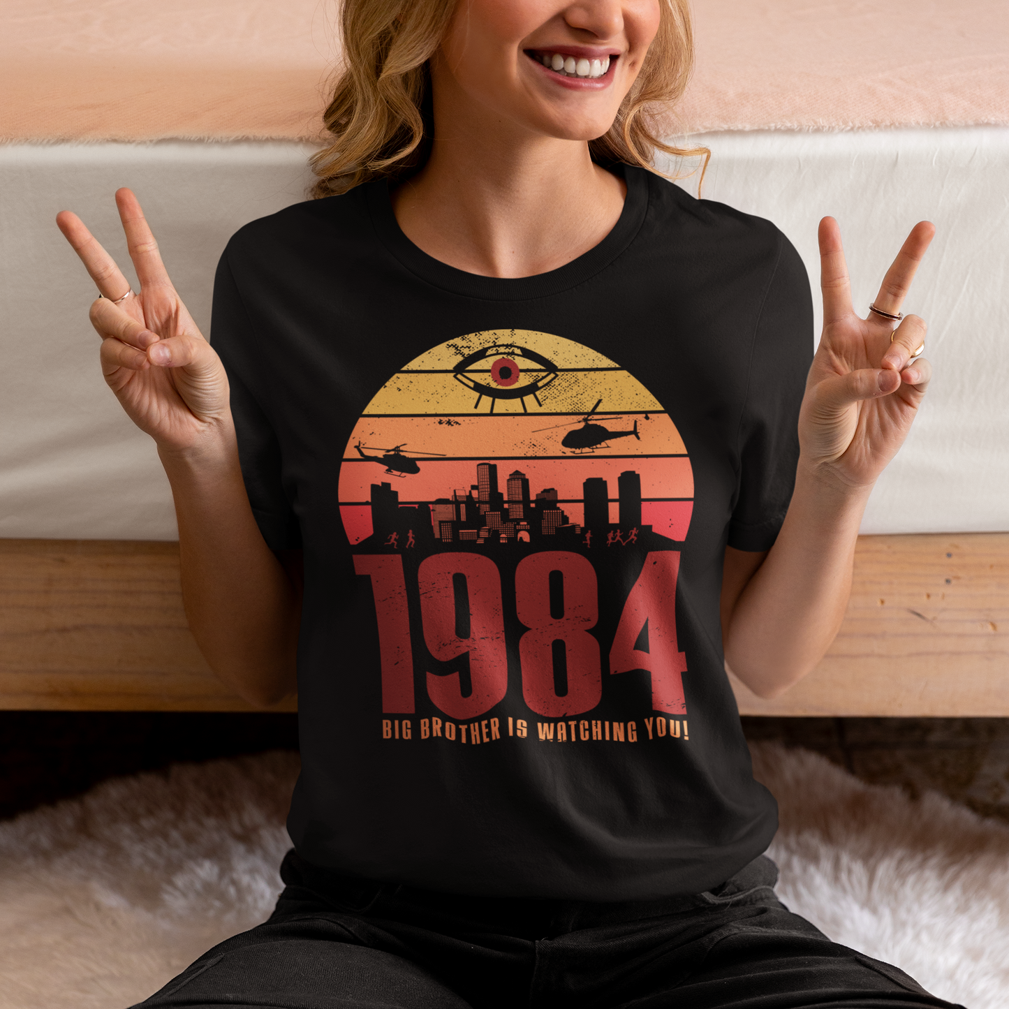 Introducing our George Orwell 1984 t-shirt with a bold "Big Brother is Watching" design! If you're a fan of Orwell's classic dystopian novel or just love thought-provoking literary references, this shirt is for you. The design features the iconic phrase "Big Brother is Watching" in small, bold letters, set against a stark sunset background. The lettering has a slightly distressed, vintage look, giving the shirt a cool, edgy vibe.