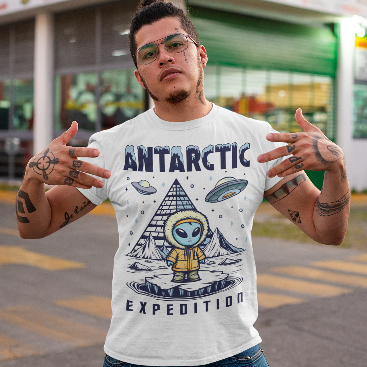 Embark on a journey to the edge of the unknown with this captivating t-shirt design. At its center stands an enigmatic Alien, clad in a weathered jacket, standing against the icy backdrop of Antarctica. The alien's presence hints at a deeper connection to the mysteries of the frozen continent. Behind the extraterrestrial figure looms a shadowy pyramid, its ancient silhouette shrouded in intrigue and secrets waiting to be unearthed.