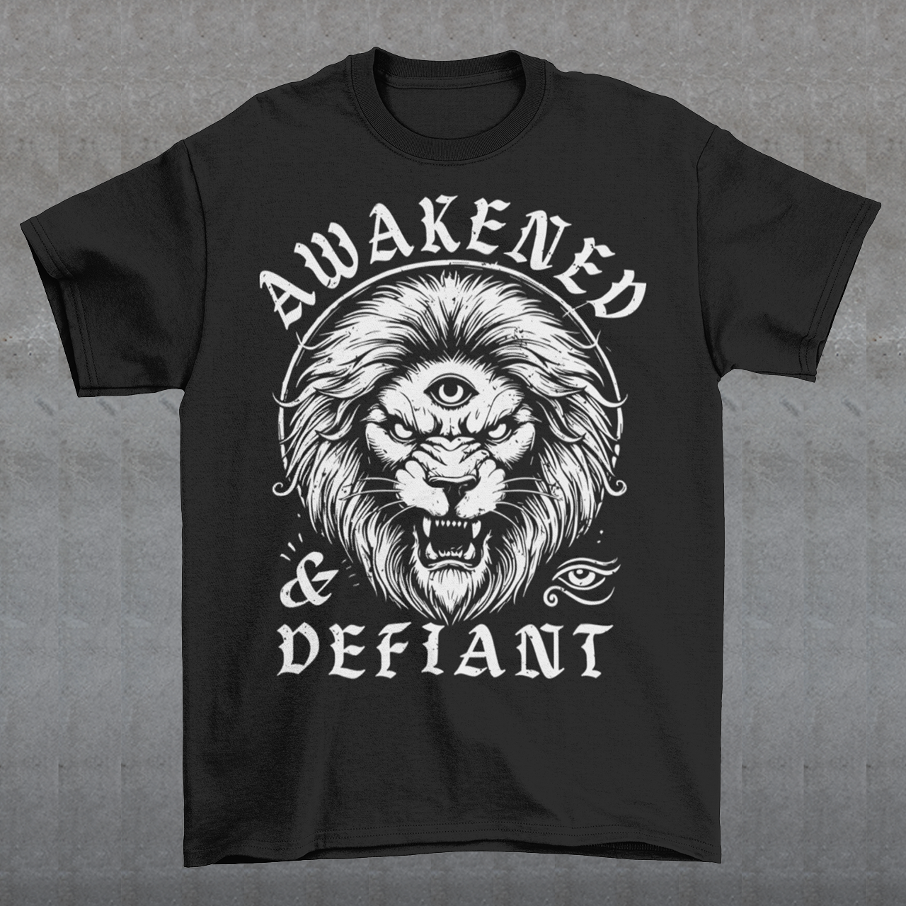 Unleash your inner power with this bold and striking t-shirt featuring a fierce lion with a mystical third eye, symbolizing heightened awareness and untamed strength. The detailed artwork showcases the lion’s intense gaze, radiating wisdom and defiance, while the text "AWAKENED & DEFIANT" amplifies the message of resilience and enlightenment. This tee is perfect for those who stand fearless, awakened, and unapologetically themselves. Wear it and embrace the spirit of the untamed.