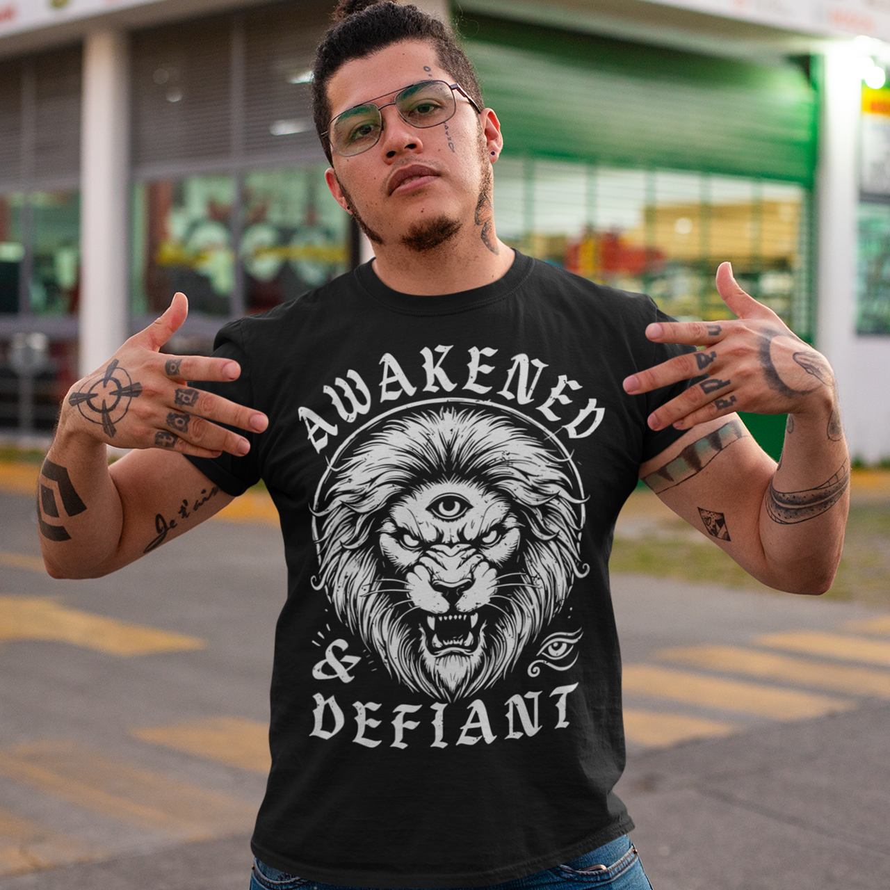Unleash your inner power with this bold and striking t-shirt featuring a fierce lion with a mystical third eye, symbolizing heightened awareness and untamed strength. The detailed artwork showcases the lion’s intense gaze, radiating wisdom and defiance, while the text "AWAKENED & DEFIANT" amplifies the message of resilience and enlightenment. This tee is perfect for those who stand fearless, awakened, and unapologetically themselves. Wear it and embrace the spirit of the untamed.