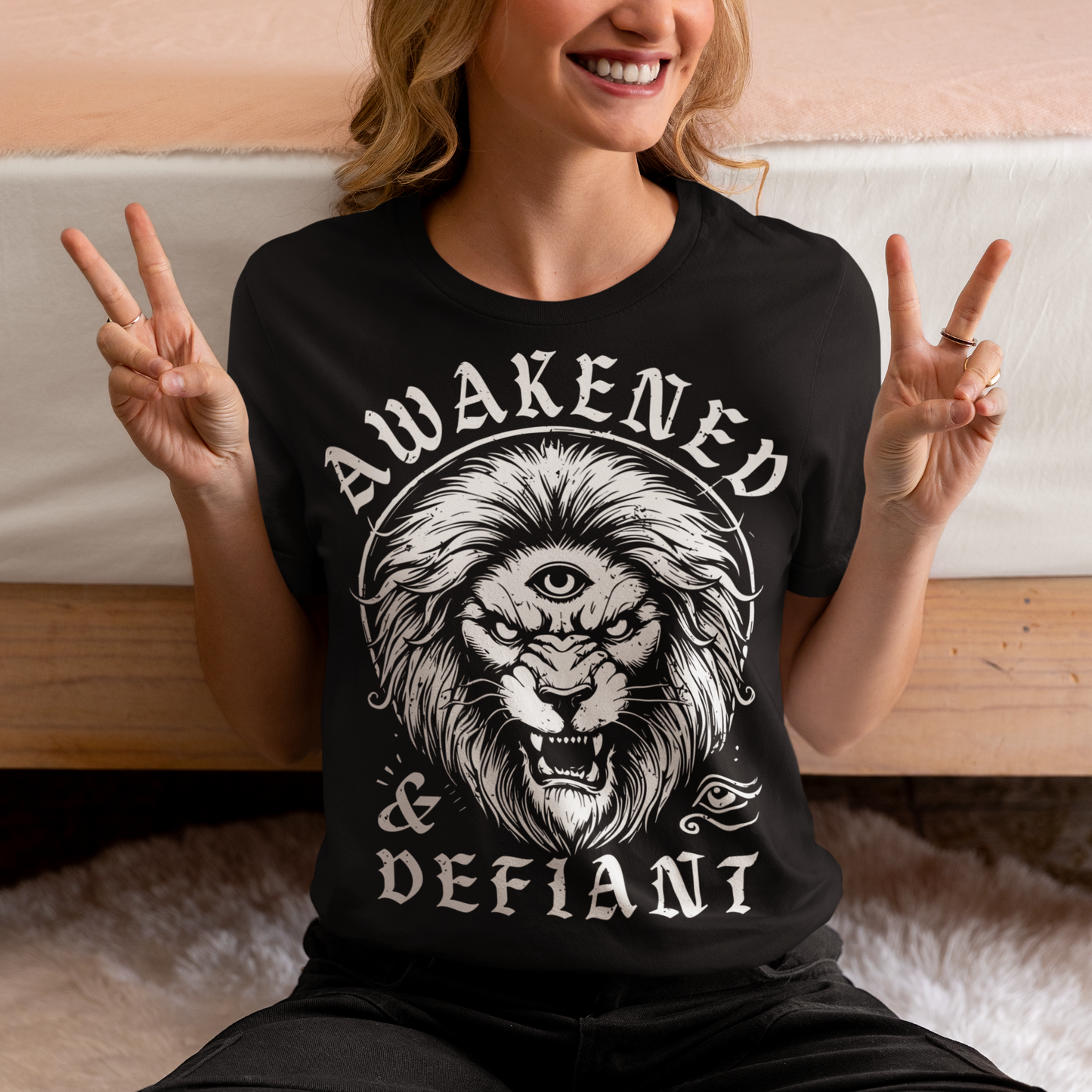 Unleash your inner power with this bold and striking t-shirt featuring a fierce lion with a mystical third eye, symbolizing heightened awareness and untamed strength. The detailed artwork showcases the lion’s intense gaze, radiating wisdom and defiance, while the text "AWAKENED & DEFIANT" amplifies the message of resilience and enlightenment. This tee is perfect for those who stand fearless, awakened, and unapologetically themselves. Wear it and embrace the spirit of the untamed.