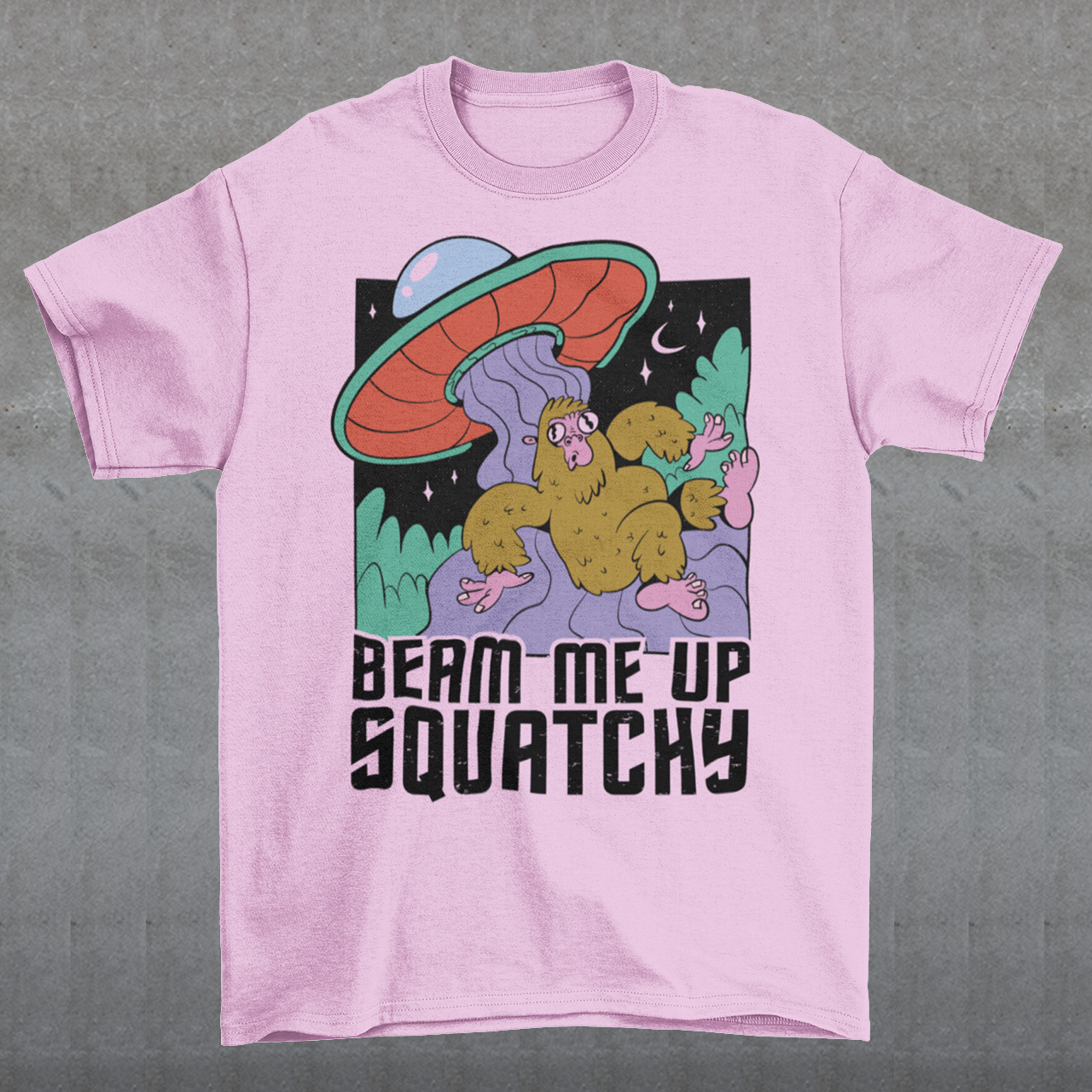Introducing the extraterrestrial enigma that'll spark conversations and laughter wherever you go – the "BEAM ME UP SQUATCHY" t-shirt. This whimsical masterpiece seamlessly blends the worlds of cryptozoology and outer space, leaving a trail of intrigue and smiles in its wake. Set against a backdrop of midnight sky, this t-shirt showcases a captivating scene that defies conventional explanation.