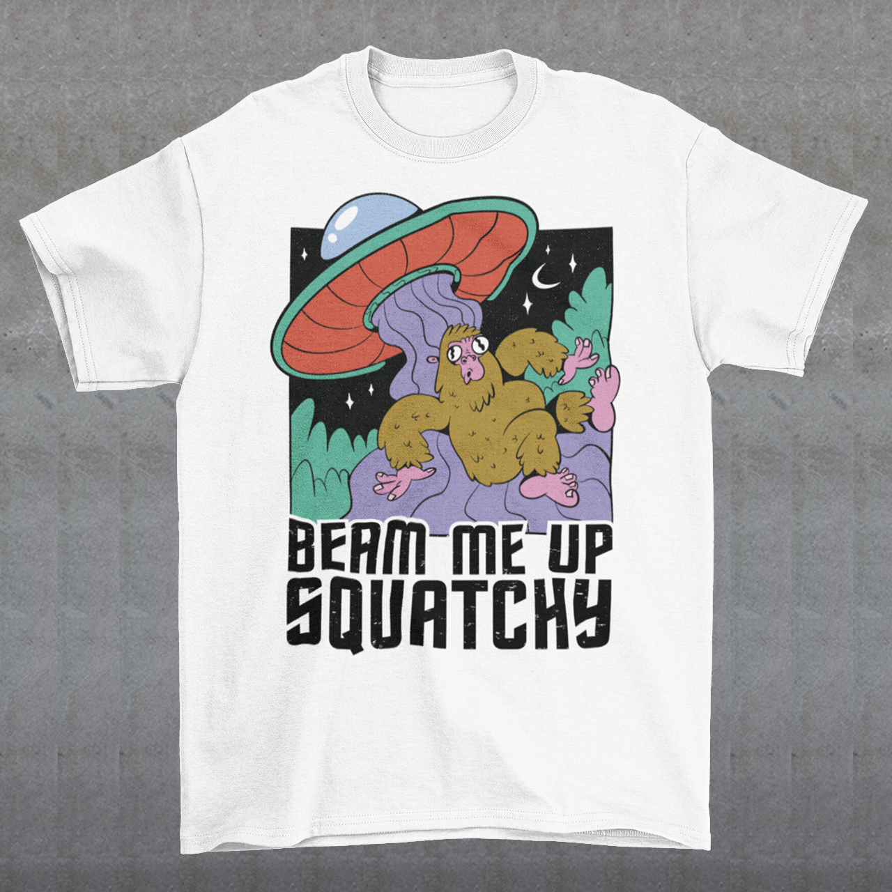Introducing the extraterrestrial enigma that'll spark conversations and laughter wherever you go – the "BEAM ME UP SQUATCHY" t-shirt. This whimsical masterpiece seamlessly blends the worlds of cryptozoology and outer space, leaving a trail of intrigue and smiles in its wake. Set against a backdrop of midnight sky, this t-shirt showcases a captivating scene that defies conventional explanation.