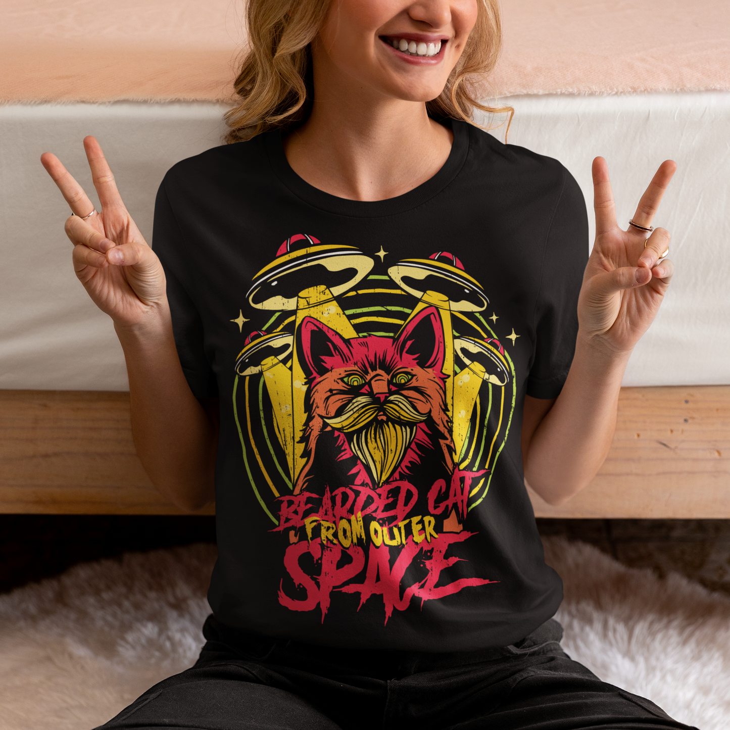 Prepare to embark on a cosmic adventure with our remarkable t-shirt featuring a bearded cat in outer space, accompanied by UFOs. This extraordinary design blends whimsy, imagination, and a touch of mystery, creating a visual feast for the eyes. At the center of the design, a majestic bearded cat takes on an otherworldly presence, its fur flowing like cosmic clouds. The cat's gaze is fixed on the vastness of space, exuding an air of curiosity and wonder.