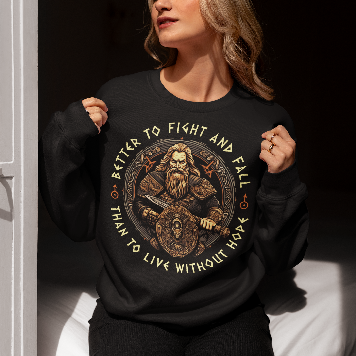 Introducing our bold and captivating Viking Warrior Sweatshirt! This extraordinary design features a fierce viking warrior, wielding a mighty sword in one hand and a sturdy shield in the other, ready to face any challenge that comes their way. The intricate artwork showcases the warrior's resolute determination and unwavering spirit. Surrounding the stunning illustration, the empowering words "BETTER TO FIGHT AND FALL THAN TO LIVE WITHOUT HOPE" are boldly displayed.