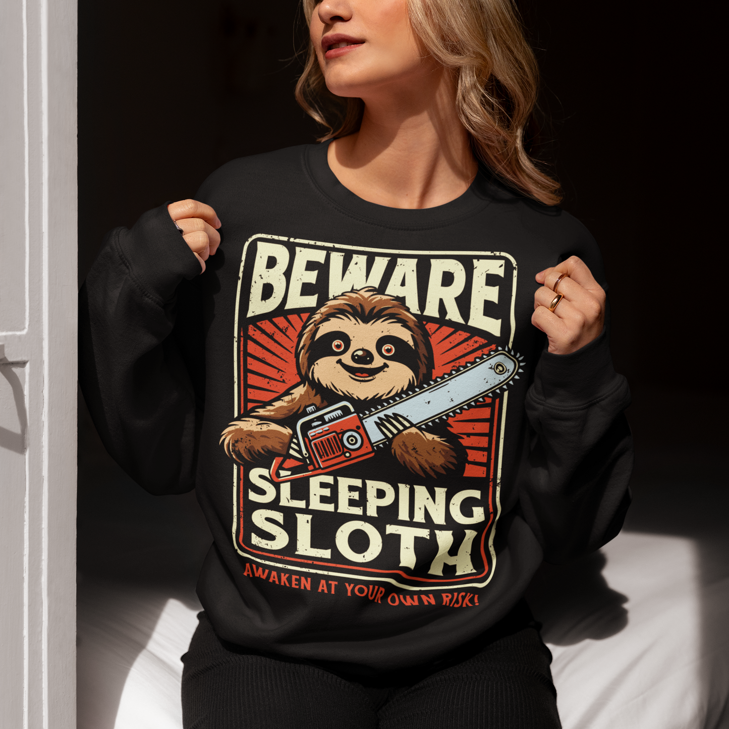 Unleash your inner wild with this hilariously unexpected shirt! Featuring a laid-back sloth wielding a chainsaw, this design turns slow and sleepy into something seriously fierce. Bold text above reads "BEWARE", while below it warns with a wink: "SLEEPING SLOTH". Perfect for those who might look relaxed on the outside but are ready to cut through anything in their path because even rebellious sloths like to stay cozy. Great for sloth lovers, pun enthusiasts, and anyone with a chill vibe.