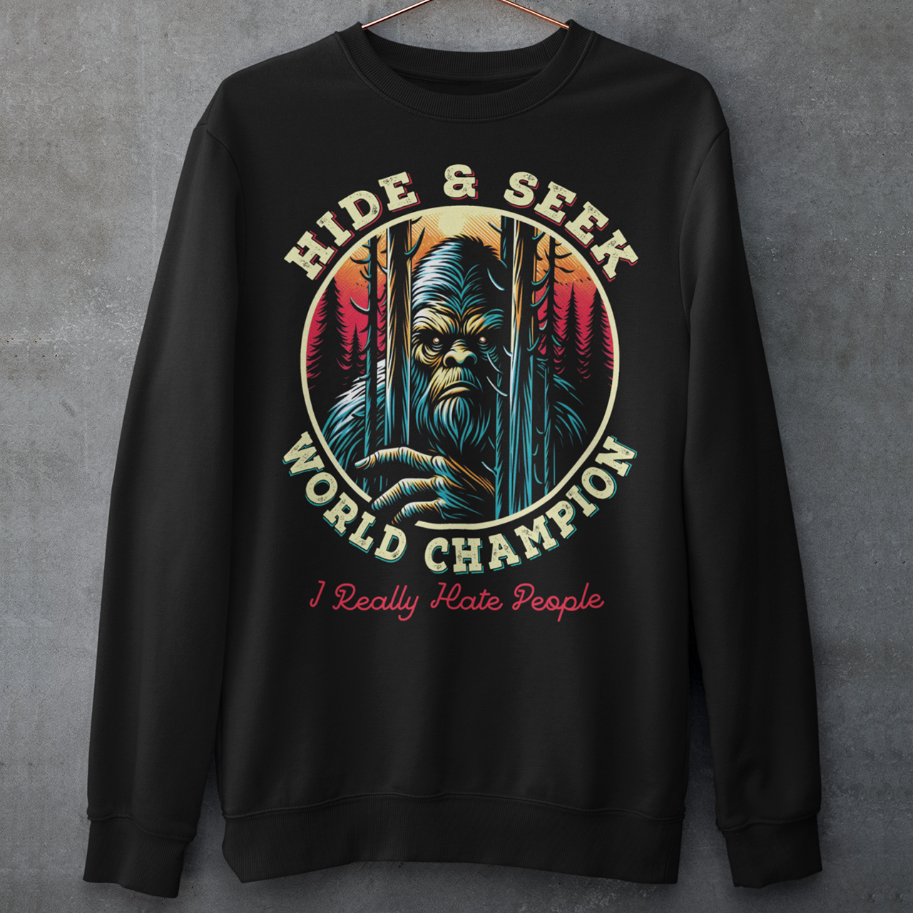 Unleash your playful side with our exclusive "Hide and Seek World Champion" Sweatshirt! This unique sweatshirt features an artistic rendition of Bigfoot peeking through a dense forest of towering trees. With a mischievous glint in his eyes, the legendary creature embodies the ultimate master of hide and seek. The bold, vintage-style text reads "HIDE and SEEK WORLD CHAMPION," celebrating Bigfoot's elusive charm.