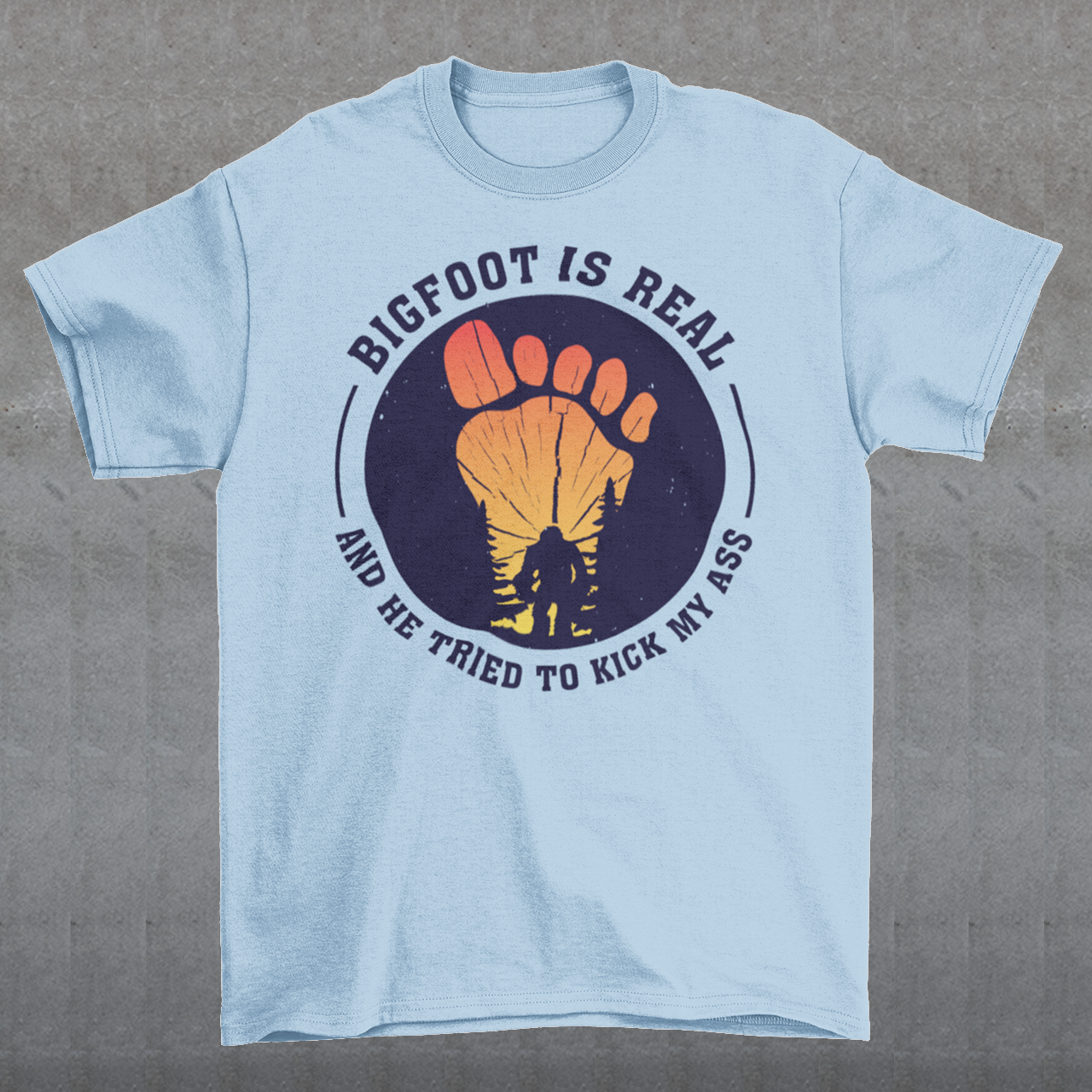 Step into the world of mysterious legends and untamed wilderness with our captivating t-shirt design featuring the legendary creature himself: Bigfoot. Against a breathtaking sunset backdrop, this design encapsulates the thrilling encounter between man and myth. At the center of the design, a striking depiction of Bigfoot takes the spotlight, his towering figure emerging from the dense forest the creature's shaggy fur and muscular frame evoke an air of primal strength and enigma.