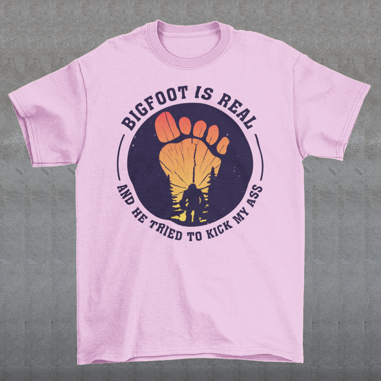 Step into the world of mysterious legends and untamed wilderness with our captivating t-shirt design featuring the legendary creature himself: Bigfoot. Against a breathtaking sunset backdrop, this design encapsulates the thrilling encounter between man and myth. At the center of the design, a striking depiction of Bigfoot takes the spotlight, his towering figure emerging from the dense forest the creature's shaggy fur and muscular frame evoke an air of primal strength and enigma.