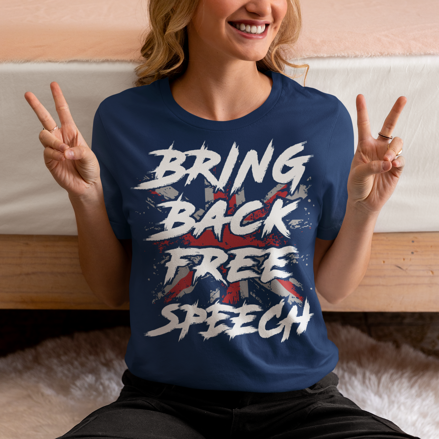 Make a bold statement with our "BRING BACK FREE SPEECH" t-shirt, featuring the iconic British flag as a backdrop to a powerful message. This design fuses patriotism with a call to action, standing up for one of the most fundamental democratic rights — freedom of expression.