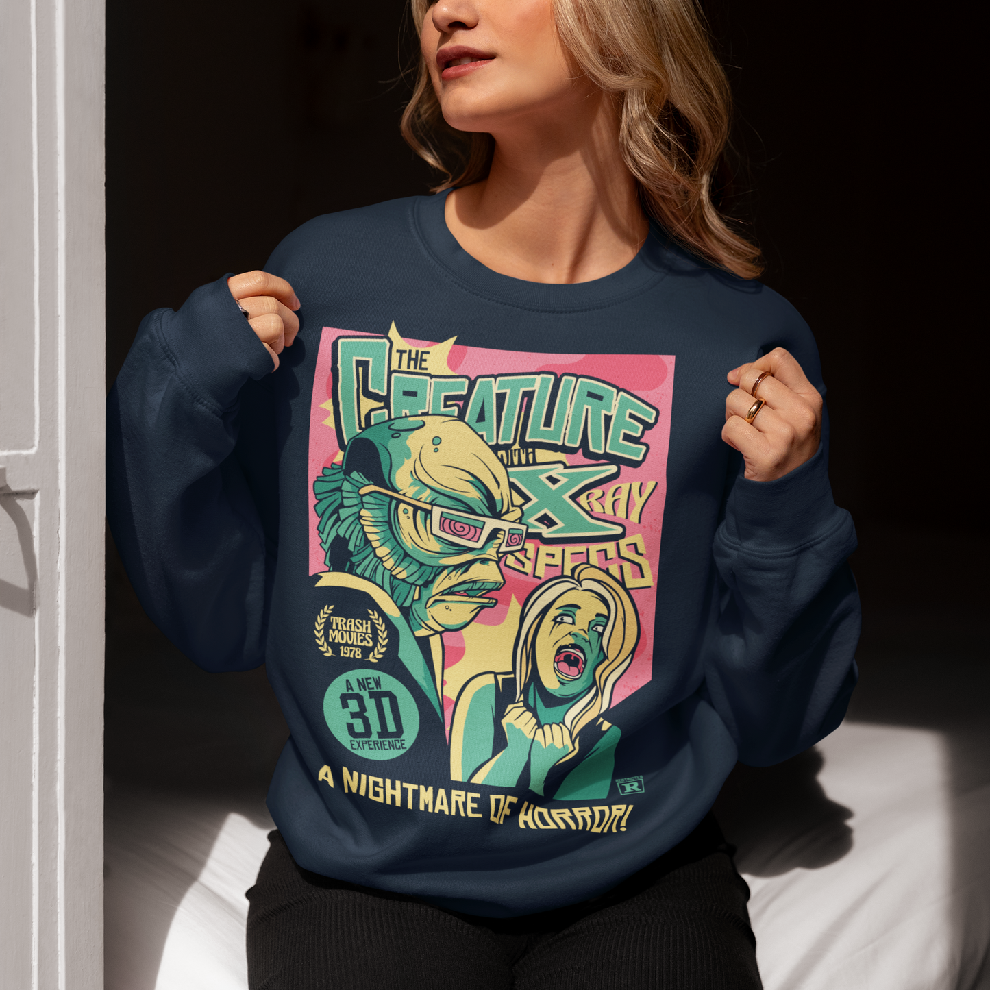 Unleash the monster within with this bold and striking Creature from the Black Lagoon comic book design. Featuring the iconic creature emerging from the depths of the murky lagoon, this shirt is a must-have for any fan of classic horror movies and graphic novels. The comic book artwork captures every terrifying detail of the creature's scaly skin and piercing eyes, making it a truly spine-chilling addition to your wardrobe.