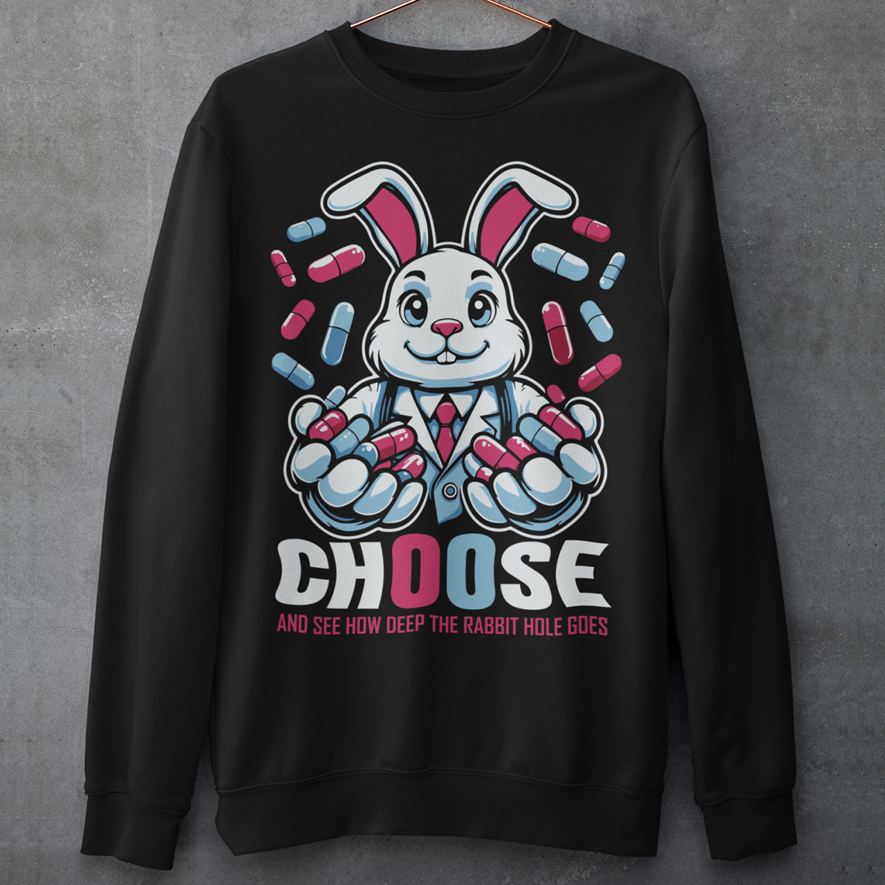 Embrace the enigmatic allure of the unknown with our captivating sweatshirt design featuring a white rabbit holding contrasting blue and red pills. This imagery beckons you to ponder the choices that define your journey. Beneath the striking illustration, bold text reads: "CHOOSE AND SEE HOW DEEP THE RABBIT HOLE GOES," inviting wearers to contemplate the consequences of their decisions and embark on a quest for truth, discovery, and self-awareness.