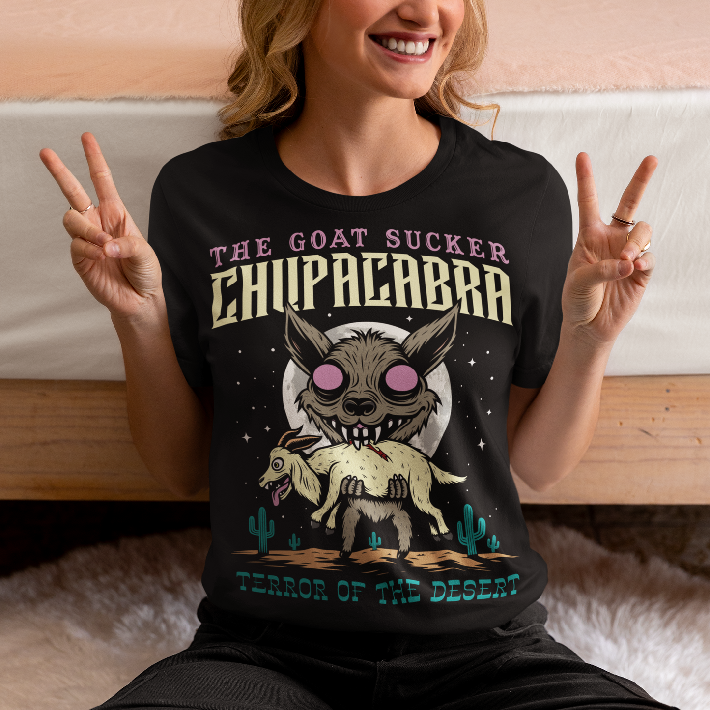 Introducing the ultimate homage to folklore and mystery – "The Goat Sucker Chupacabra" T-shirt! Step into the realm of the unknown with this captivating design depicting the infamous chupacabra in action. Against the backdrop of a barren desert, the chupacabra is depicted in all its eerie glory, locked in its iconic pose of sucking the life force from a hapless goat. Above the striking imagery, bold text proudly proclaims "THE GOAT SUCKER CHUPACABRA" ensuring that the wearer embodies the legend.