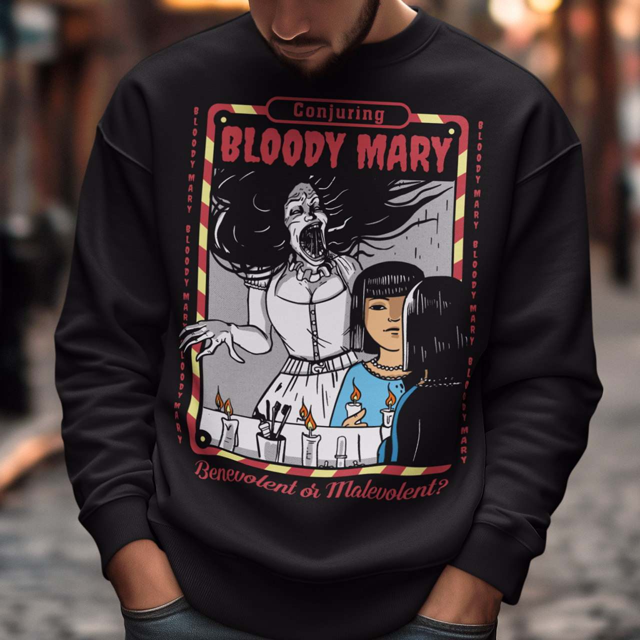 Dare to look twice. This chilling sweatshirt features a haunting design of a girl staring into a mirror—only to find Bloody Mary staring back from the reflection. Above, the bold words “Conjuring Bloody Mary” summon the legend, while below, the question “Benevolent or malevolent?” dares the viewer to decide. This shirt is perfect for horror fans, urban legend lovers, and anyone who enjoys walking the line between myth and reality.
