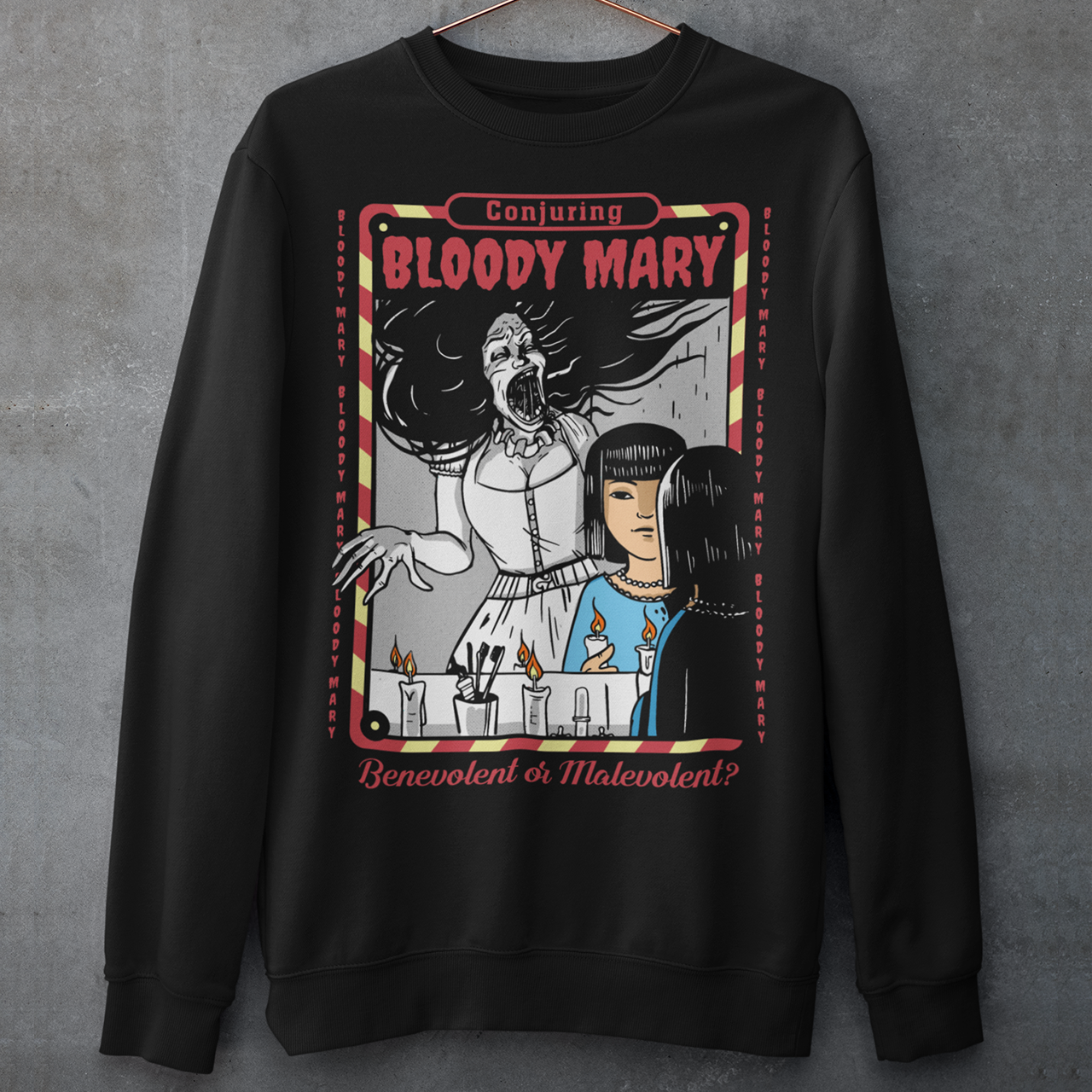 Dare to look twice. This chilling sweatshirt features a haunting design of a girl staring into a mirror—only to find Bloody Mary staring back from the reflection. Above, the bold words “Conjuring Bloody Mary” summon the legend, while below, the question “Benevolent or malevolent?” dares the viewer to decide. This shirt is perfect for horror fans, urban legend lovers, and anyone who enjoys walking the line between myth and reality.