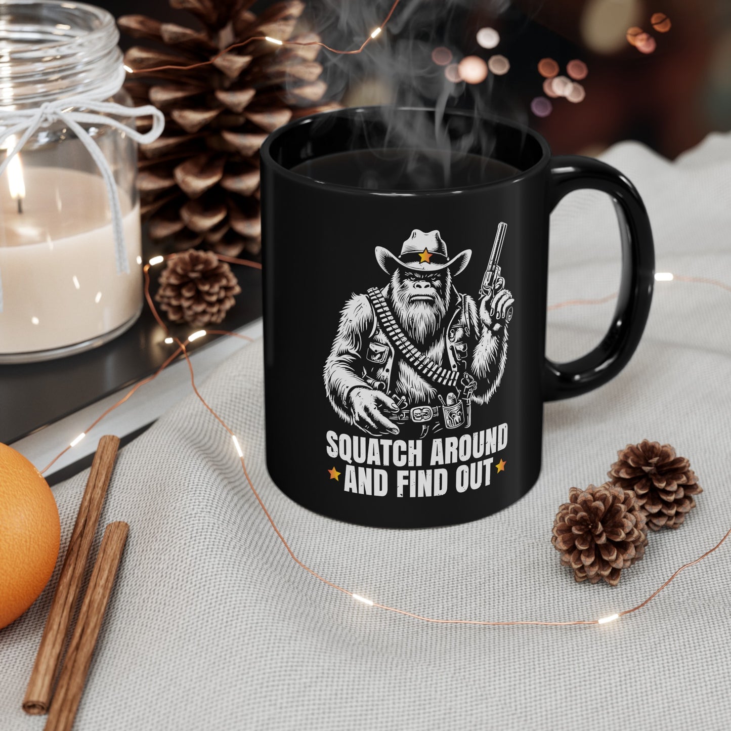 Black mug of a sheriff Sasquatch in the wild west holding a gun with text underneath SQUATCH AROUND AND FIND OUT.