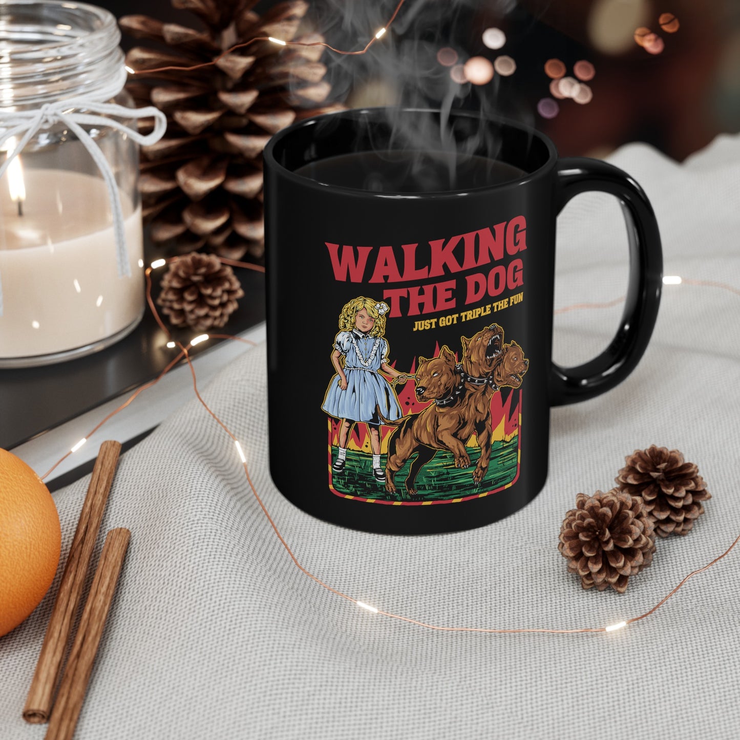Black mug of a girl taking Cerberus dog for a walk with text WALKING THE DOG JUST GOT TRIPLE THE FUN.