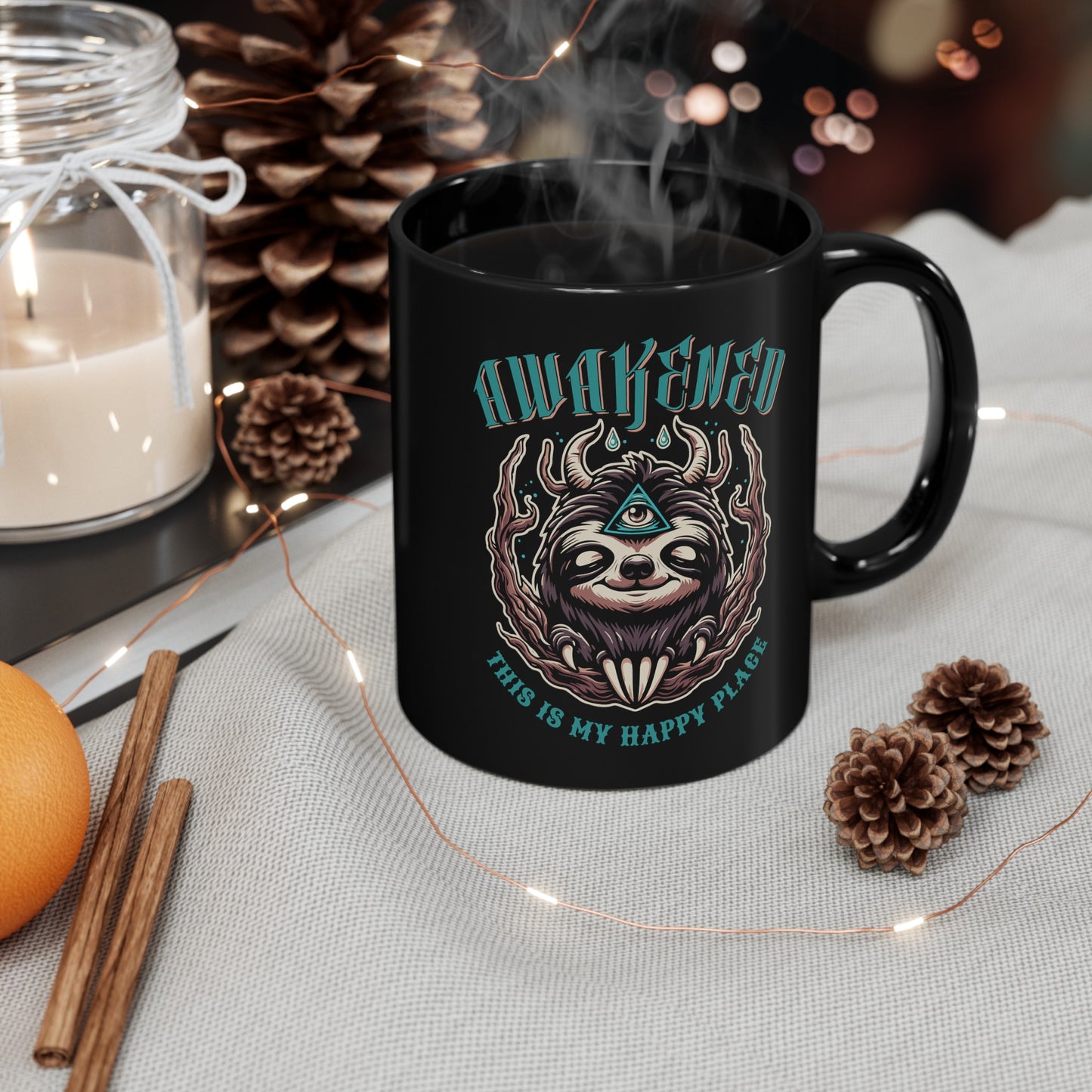 Black mug of a sloth with a third eye with text above AWAKENED and text below THIS IS MY HAPPY PLACE.