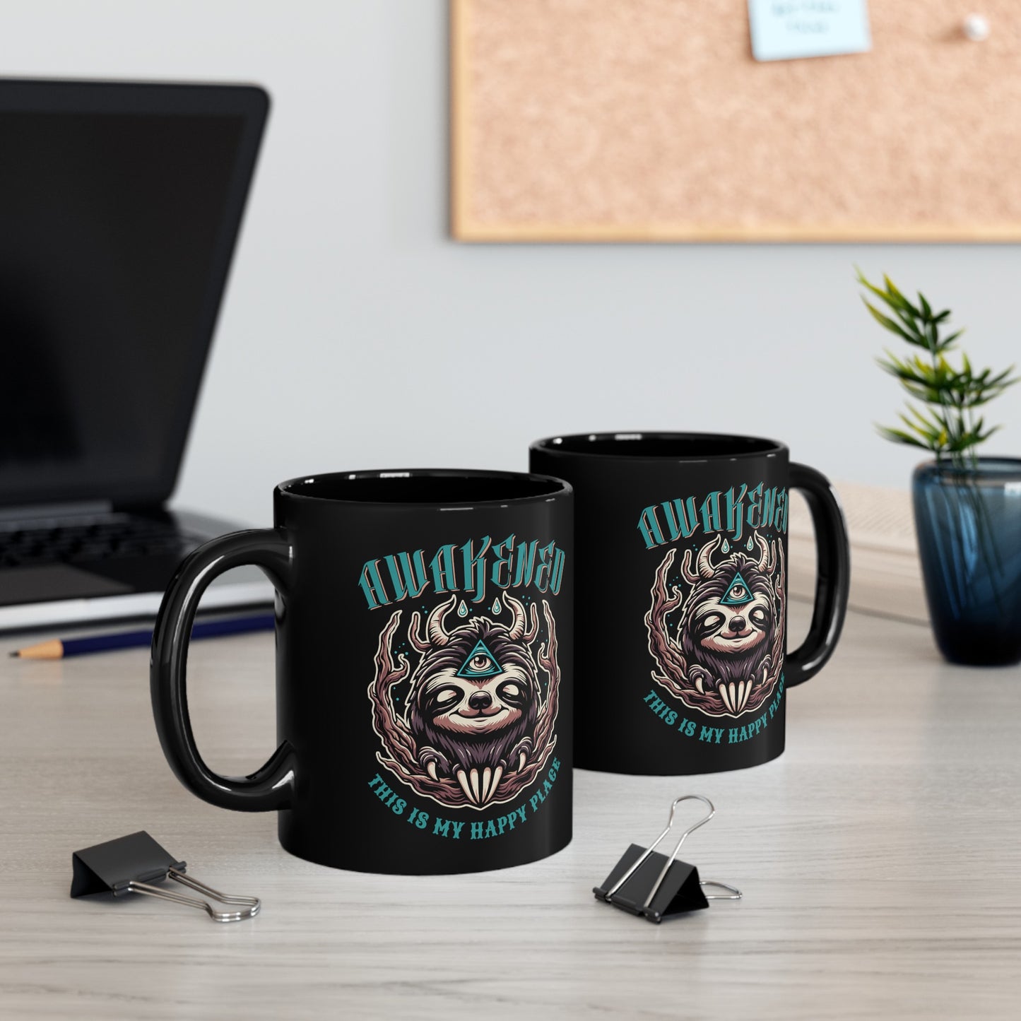 Black mug of a sloth with a third eye with text above AWAKENED and text below THIS IS MY HAPPY PLACE.