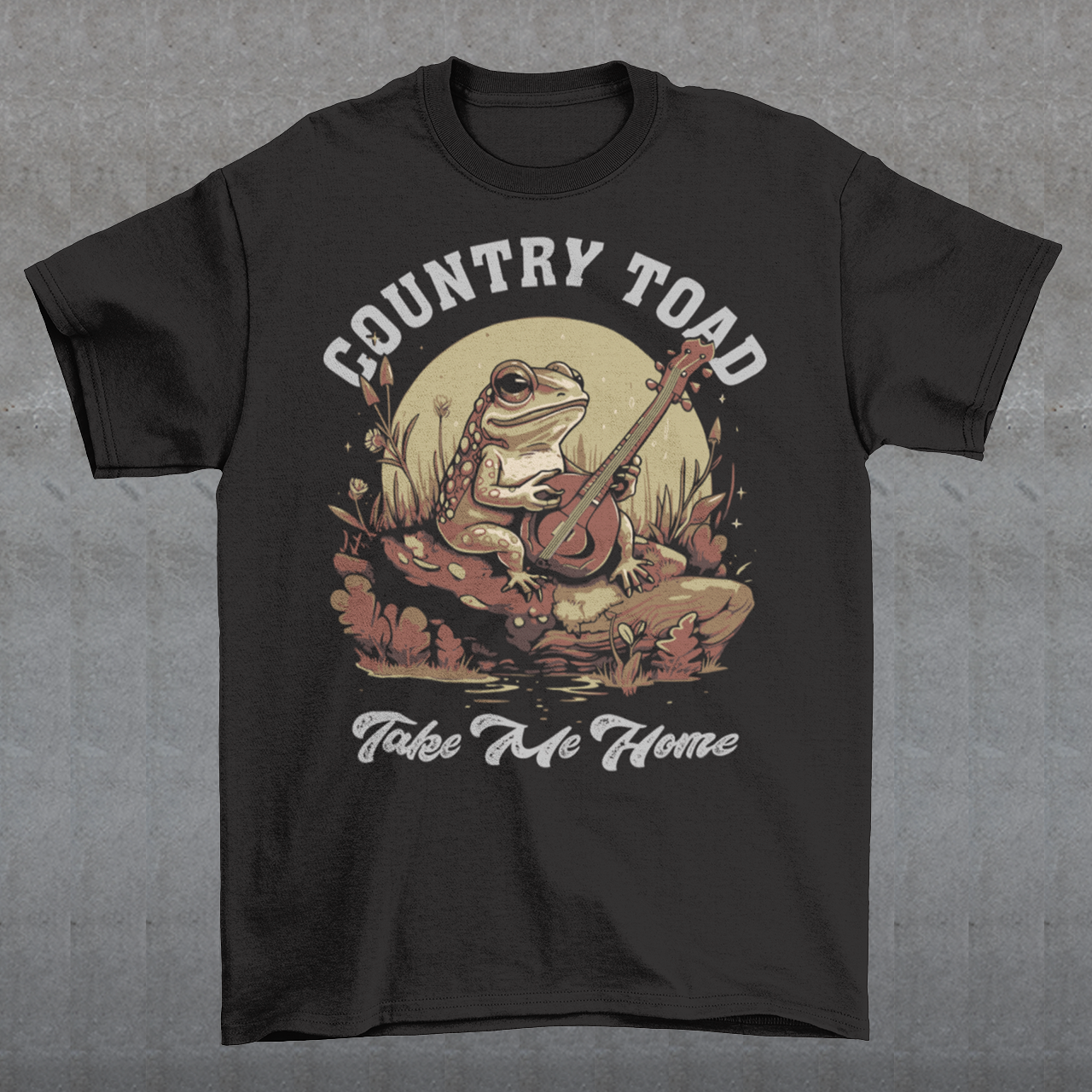 Introducing our delightful "Country Toad Take Me Home" t-shirt, where whimsy and charm come together in perfect harmony. This enchanting design captures the essence of a peaceful evening in the countryside, transporting you to a world where nature and music blend seamlessly. At the center of the design, you'll find a vibrant depiction of a serene pond illuminated by the gentle glow of the moon. Resting on a moss-covered rock, a plucky frog musician steals the show as it strums a banjo.
