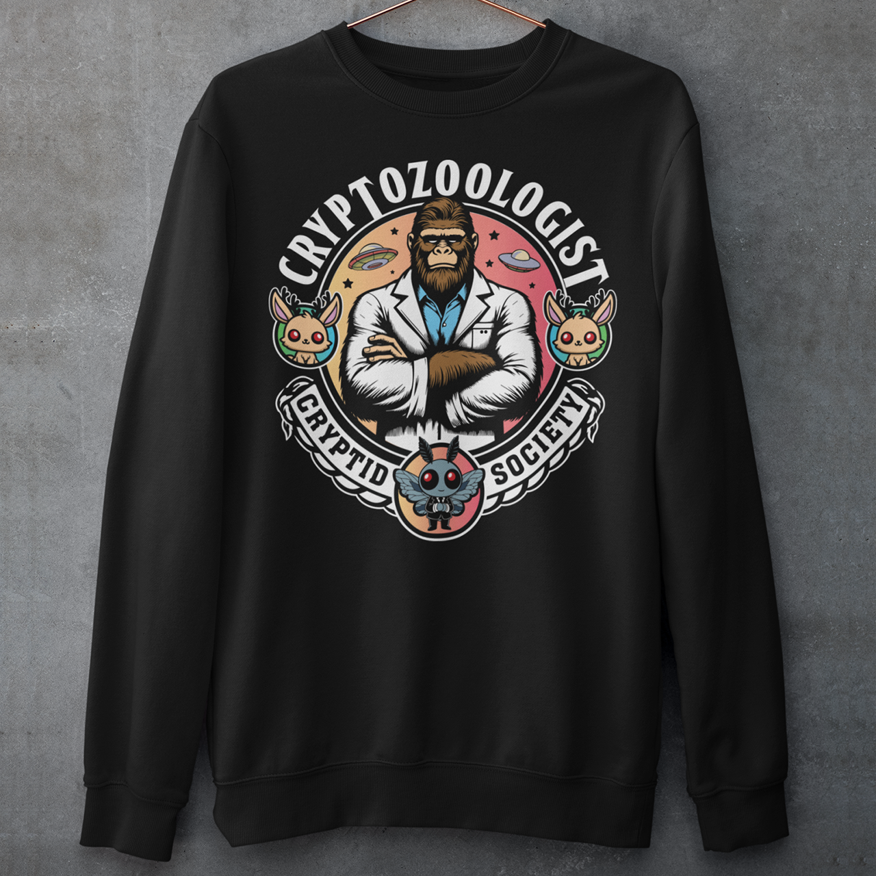 Introducing our enigmatic Cryptozoologist sweatshirt, where the mysteries of the unknown converge in an eye-catching design! Picture this: a towering Bigfoot, not merely a creature of folklore, but an esteemed scientist of the wilderness. Behind this enigmatic figure, the night sky is alive with the shimmering presence of UFOs, hinting at extraterrestrial encounters and the secrets they may hold.
