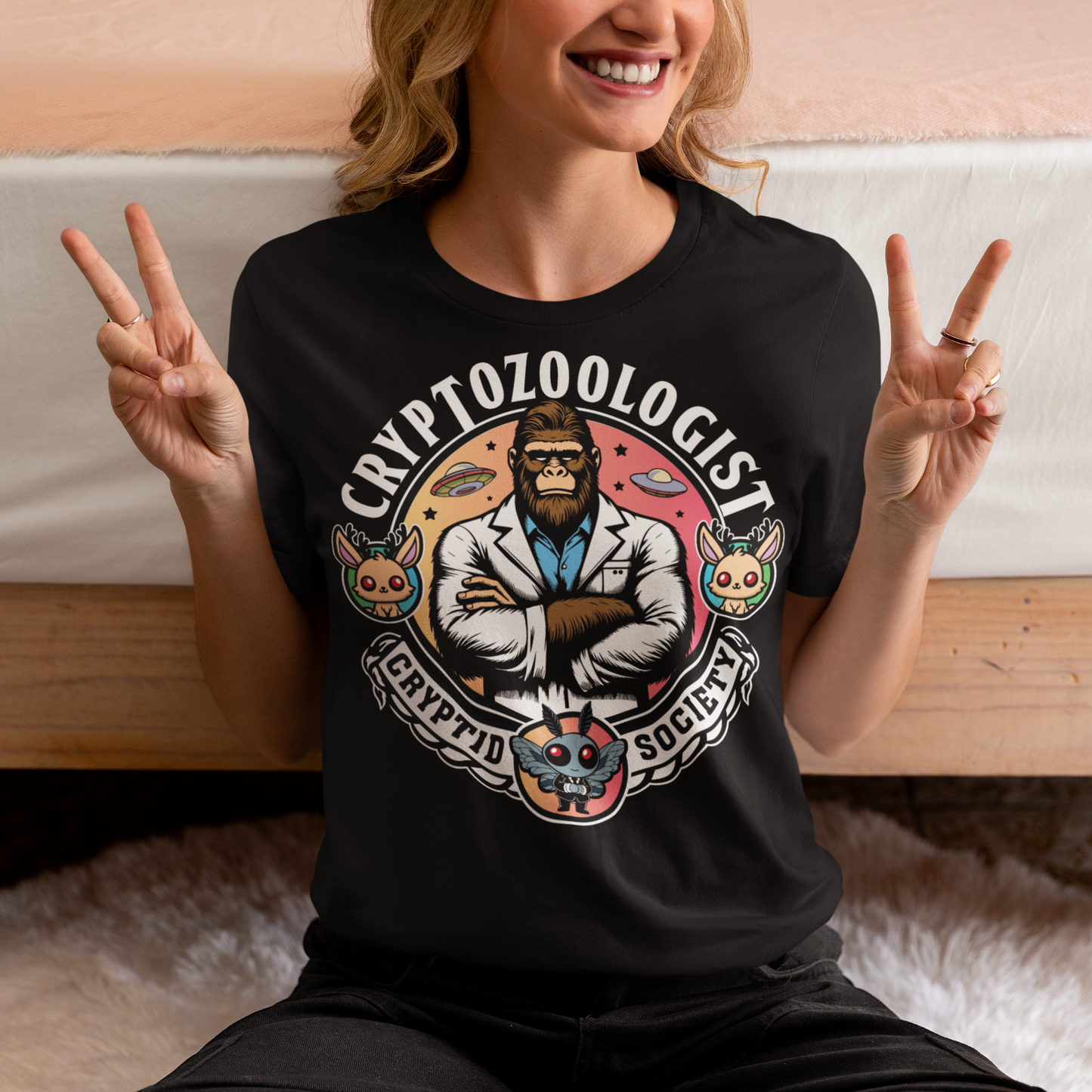 Introducing our enigmatic Cryptozoologist t-shirt, where the mysteries of the unknown converge in an eye-catching design! Picture this: a towering Bigfoot, not merely a creature of folklore, but an esteemed scientist of the wilderness. Behind this enigmatic figure, the night sky is alive with the shimmering presence of UFOs, hinting at extraterrestrial encounters and the secrets they may hold.