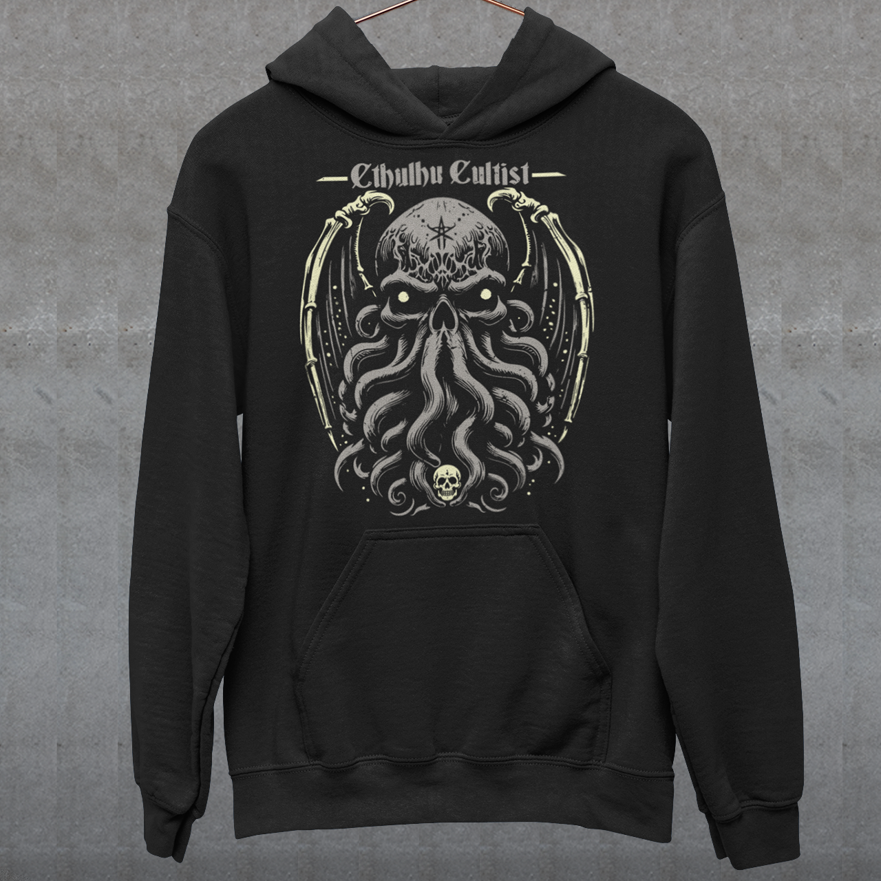 Unleash your dark allegiance with this bold graphic tee featuring a haunting skull-faced Cthulhu design. Tentacles twist and coil beneath a menacing skeletal visage, merging death and madness in one unforgettable image. Above the ancient cosmic horror, the words “Cthulhu Cultist” loom in eldritch-style lettering, marking you as a devoted follower of the Great Old One. Perfect for fans of Lovecraftian horror, dark fantasy, or anyone drawn to the mysterious depths of the unknown.