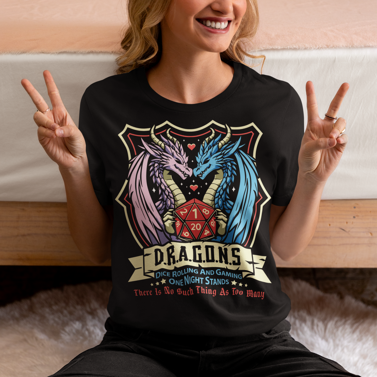 Embrace your inner adventurer with this bold and witty D.R.A.G.O.N.S. Shield Emblem T-Shirt. At the heart of the design is a powerful crest-style shield, flanked by a fierce male and female dragon, symbolizing strength, balance, and epic storytelling. Centered within the shield is a classic RPG dice, gleaming with gamer pride. Perfect for tabletop warriors, RPG fans, and those who roll for both initiative and fun.