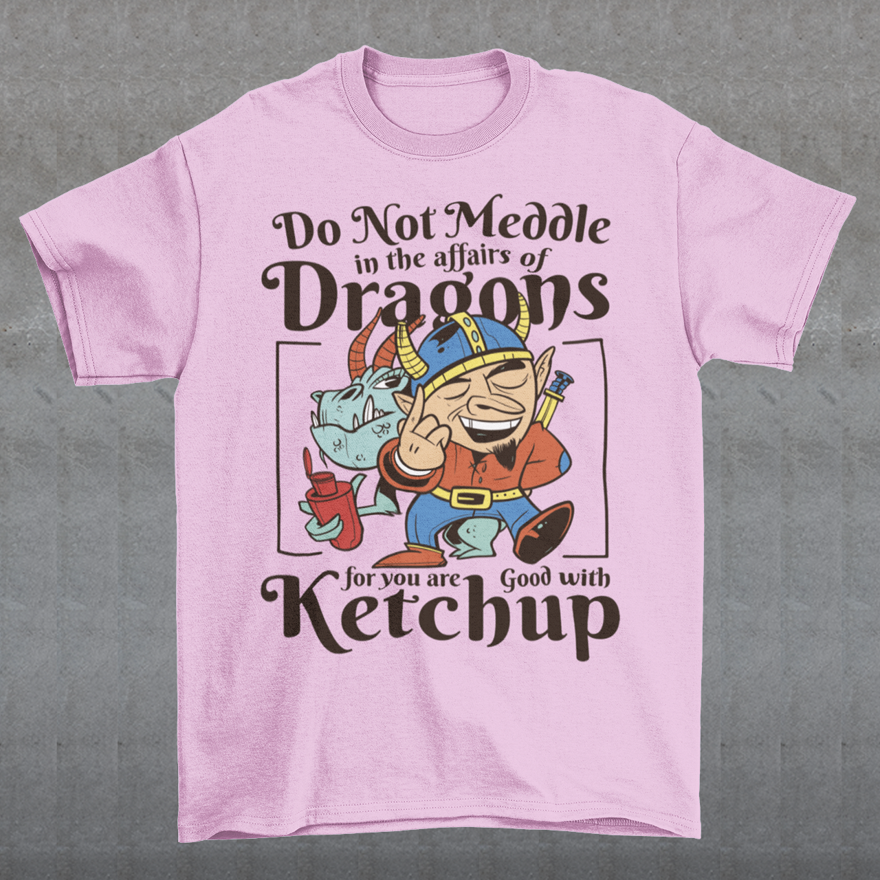 Introducing our whimsically fierce and flavorful "Dragon Connoisseur" T-shirt! This eye-catching design features a majestic dragon with a mischievous grin, proudly holding a bottle of ketchup, standing ominously behind a brave Viking. The caption, "DO NOT MEDDLE IN THE AFFAIRS OF DRAGONS FOR YOU ARE GOOD WITH KETCHUP," adds a touch of humor and a warning to all who dare to challenge the fiery and saucy taste preferences of these mythical creatures.
