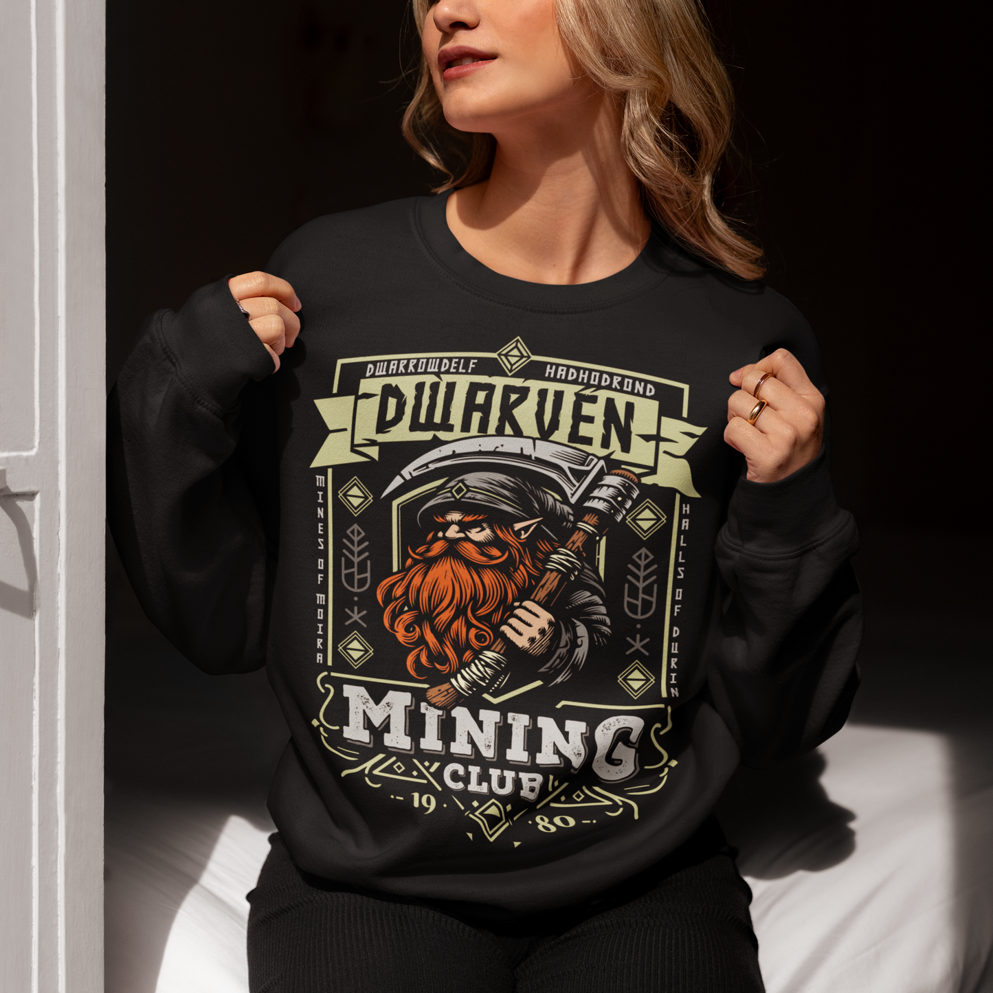 Join the ranks of the underground elite with our Dwarven Mining Club sweatshirt! Featuring a bold illustration of a rugged dwarf — pickaxe in hand, beard thick with grit, and a steely glint in his eye — this design is perfect for fans of fantasy, adventure, and all things dwarven. The distressed DWARVEN MINING CLUB text gives it a vintage, hard-worn look, like it’s seen years of digging deep into the earth. Whether you're gaming, cosplaying, or just showing off your love for the stoutest race in fantasy lor