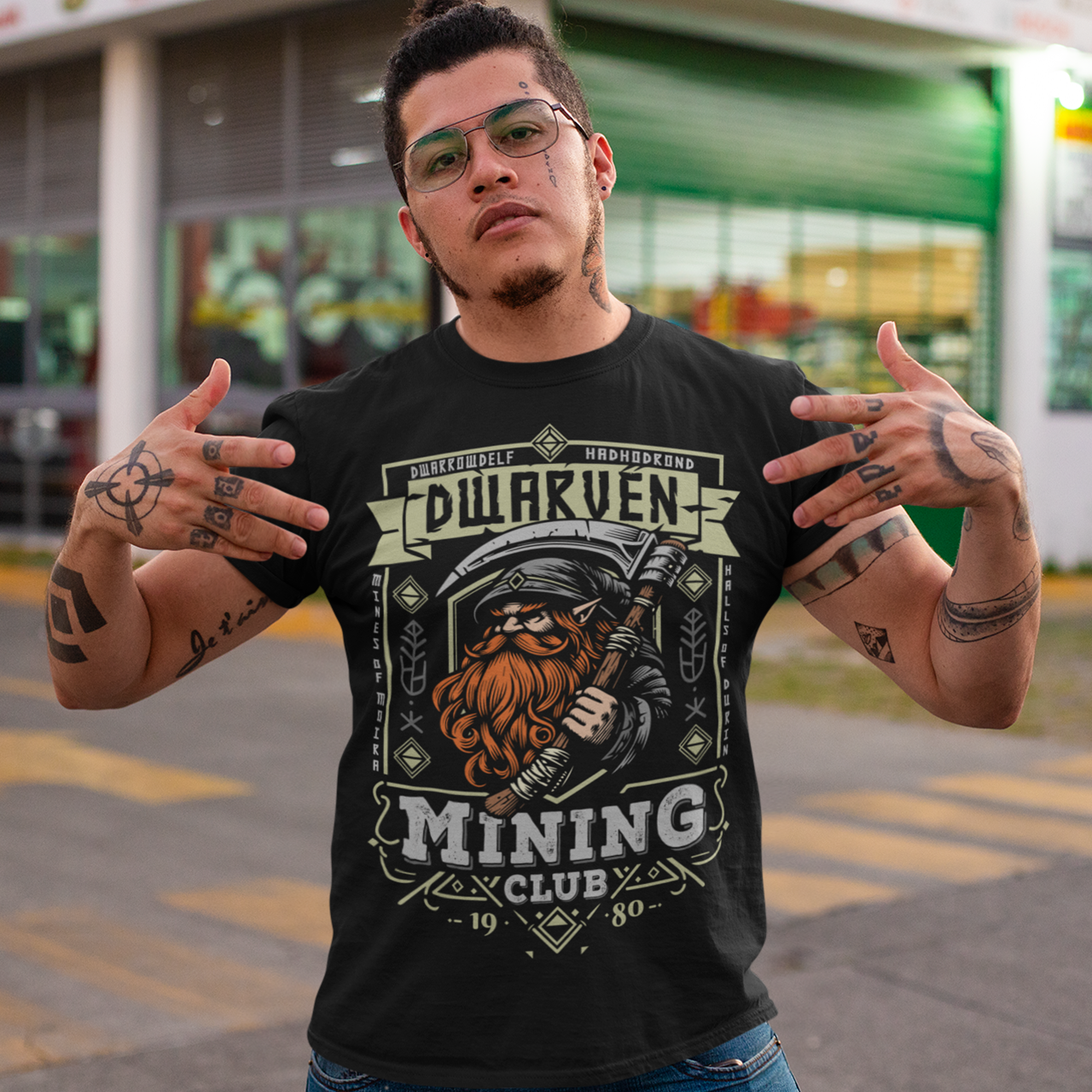Join the ranks of the underground elite with our Dwarven Mining Club t-shirt! Featuring a bold illustration of a rugged dwarf — pickaxe in hand, beard thick with grit, and a steely glint in his eye — this design is perfect for fans of fantasy, adventure, and all things dwarven. The distressed DWARVEN MINING CLUB text gives it a vintage, hard-worn look, like it’s seen years of digging deep into the earth. Whether you're gaming, cosplaying, or just showing off your love for the stoutest race in fantasy lore,