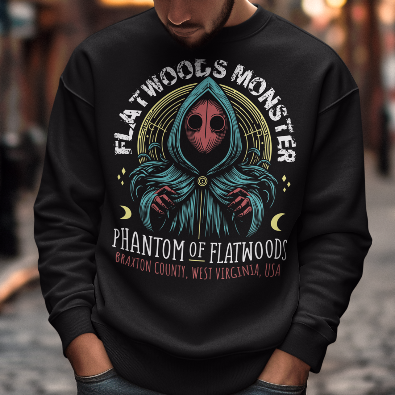Introducing our Flatwoods Monster sweatshirt, where eerie meets style! Above the iconic image of the cryptid, bold white letters spell out "FLATWOODS MONSTER," while below, in a spooky font, "PHANTOM OF FLATWOODS" sets the mood. This sweatshirt is perfect for enthusiasts of the paranormal, UFO aficionados, or anyone with an eye for the enigmatic. Flaunt your fascination with the unknown and spark conversations wherever you go.