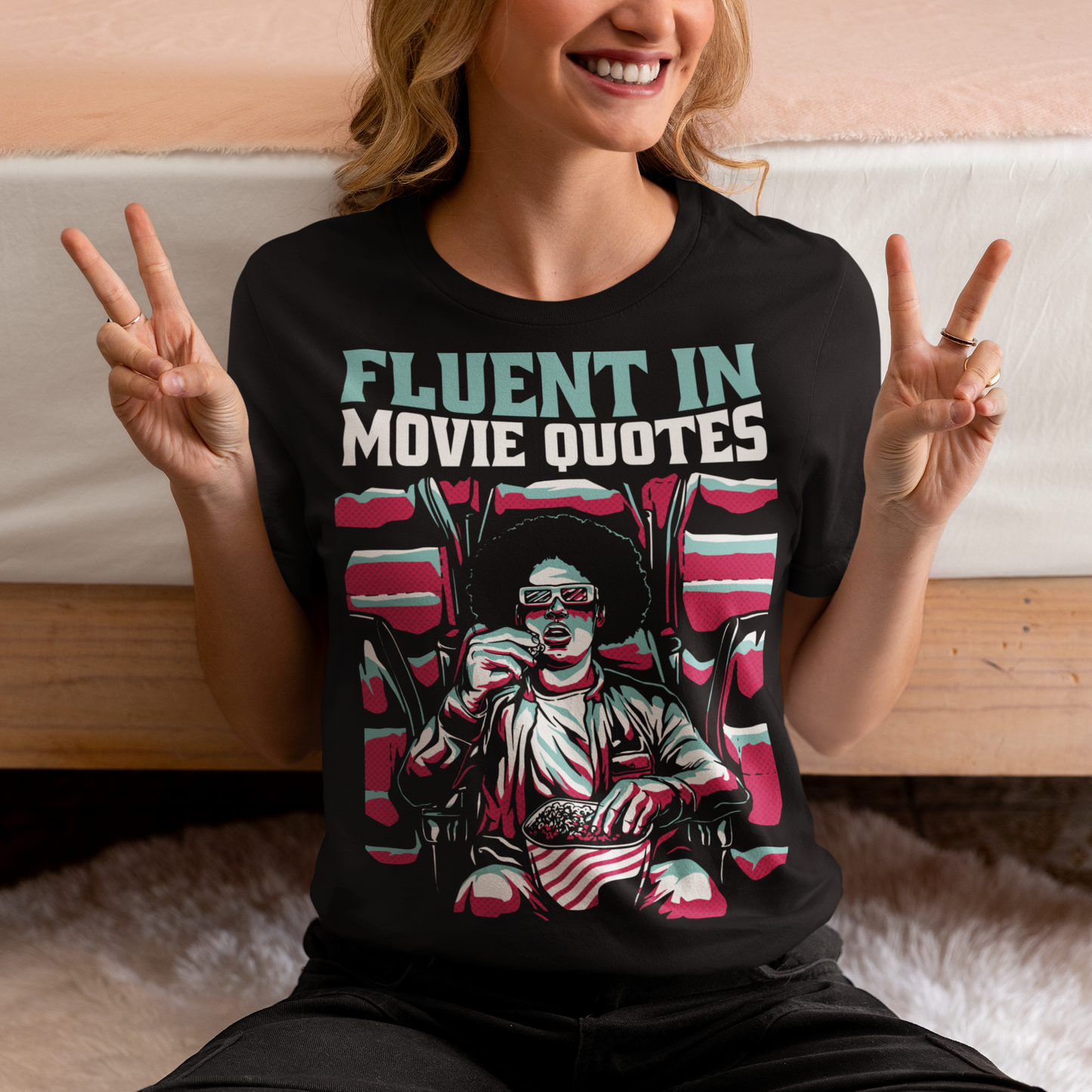 Introducing the "Fluent in Movie Quotes" T-Shirt, a must-have for all movie buffs and cinema enthusiasts! This unique and eye-catching design features a person wearing classic red and blue 3D glasses, fully immersed in a thrilling movie experience at the cinema. With a bucket of popcorn in hand, this individual is the epitome of a true film lover.