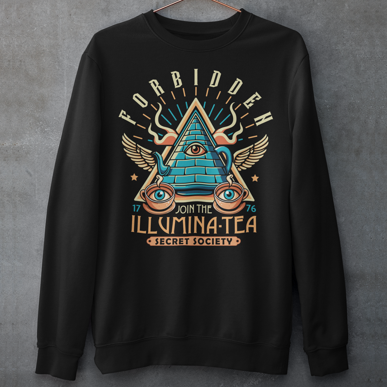 Step into the mysterious world of the Illuminati with this enigmatic sweatshirt featuring a captivating design of a tea pot and cups, each adorned with iconic Illuminati symbols. Delve into the depths of secrecy as you sip your tea, knowing that you possess the knowledge of the ages. With its clever wordplay, the text "ILLUMINA-TEA" adds a playful twist, inviting intrigue and curiosity from those around you.