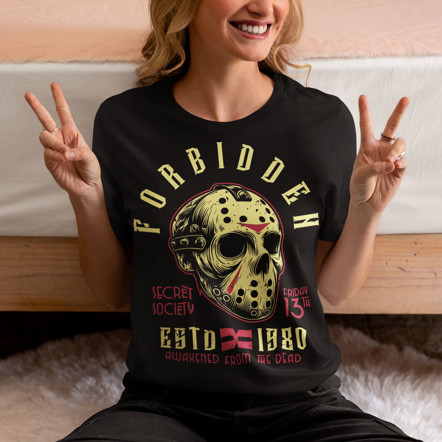 Get ready to turn heads with this spine-chilling t-shirt featuring a graphic of a sinister, battle-worn hockey mask. Around the mask, the text "FORBIDDEN SECRET SOCIETY AWAKENED FROM THE DEAD" looms in jagged, eerie lettering. The design has a gritty, distressed style, evoking an unsettling sense of mystery and menace. Perfect for horror enthusiasts, this shirt brings a dark aesthetic and an air of the supernatural, making it a must-have for those who like their fashion on the dark side.