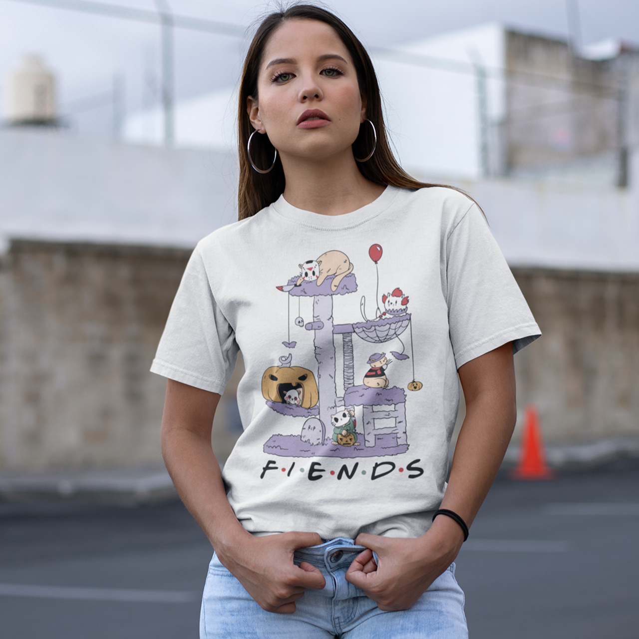 White halloween t-shirt of horror cat characters on a cat tree with text "FIENDS".
