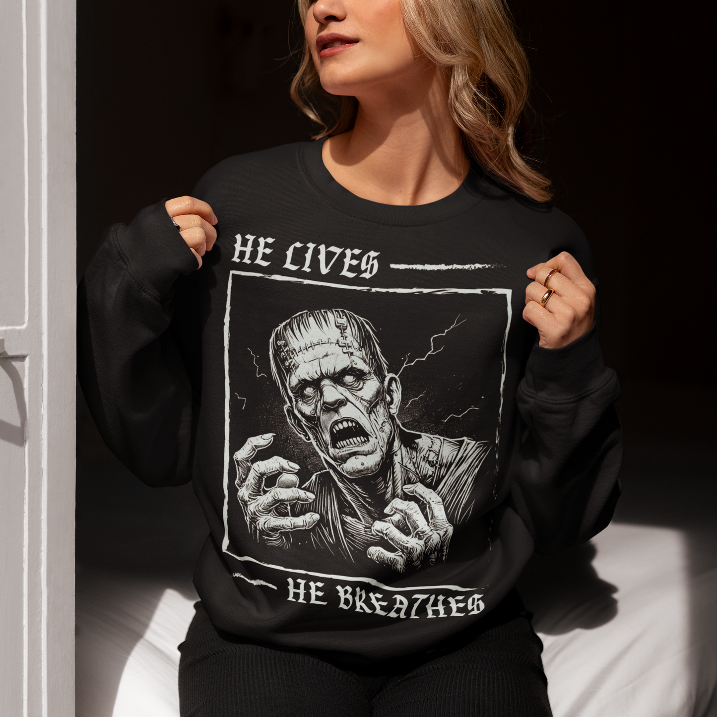 Unleash the power of classic horror with this bold Frankenstein Sweatshirt! Featuring a striking, high-contrast illustration of Frankenstein’s monster, the design captures the iconic creature in vivid detail, with piercing eyes and a dramatic aura of life and electricity. Wear it to make a statement, celebrate the macabre, or just show off your love for the timeless tale of Frankenstein’s monster.