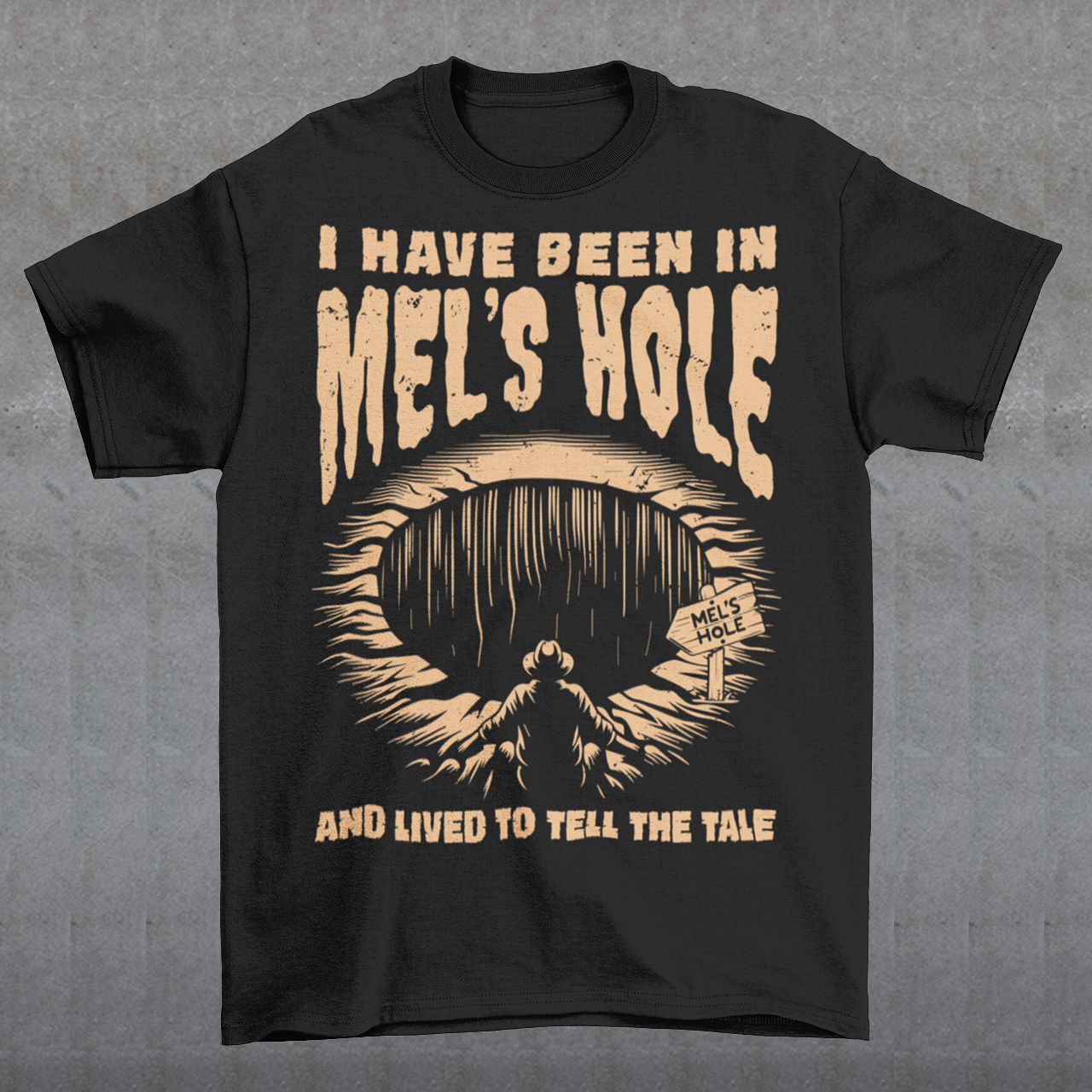 Step into the strange with this quirky and mysterious tee! Featuring a bold illustration of a curious man peering into a dark, bottomless abyss, this shirt pays homage to the legendary paranormal tale of Mel's Hole — a supposed infinite pit in the wilds of Washington State. The vintage-style artwork is topped with the eerie invitation: "VISIT MEL'S HOLE" in retro tourism font, blending humor, folklore, and a dash of the unexplained.