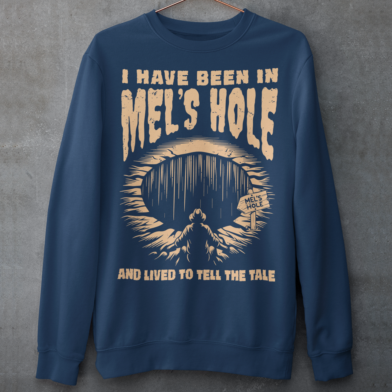 Step into the strange with this quirky and mysterious shirt! Featuring a bold illustration of a curious man peering into a dark, bottomless abyss, this shirt pays homage to the legendary paranormal tale of Mel's Hole — a supposed infinite pit in the wilds of Washington State. The vintage-style artwork is topped with the eerie invitation: "VISIT MEL'S HOLE" in retro tourism font, blending humor, folklore, and a dash of the unexplained.