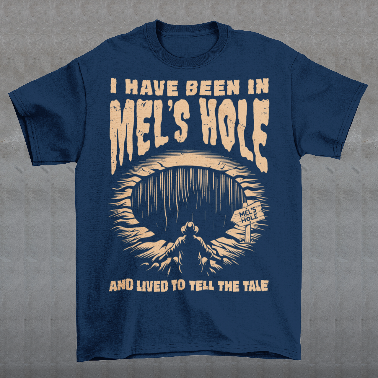 Step into the strange with this quirky and mysterious tee! Featuring a bold illustration of a curious man peering into a dark, bottomless abyss, this shirt pays homage to the legendary paranormal tale of Mel's Hole — a supposed infinite pit in the wilds of Washington State. The vintage-style artwork is topped with the eerie invitation: "VISIT MEL'S HOLE" in retro tourism font, blending humor, folklore, and a dash of the unexplained.