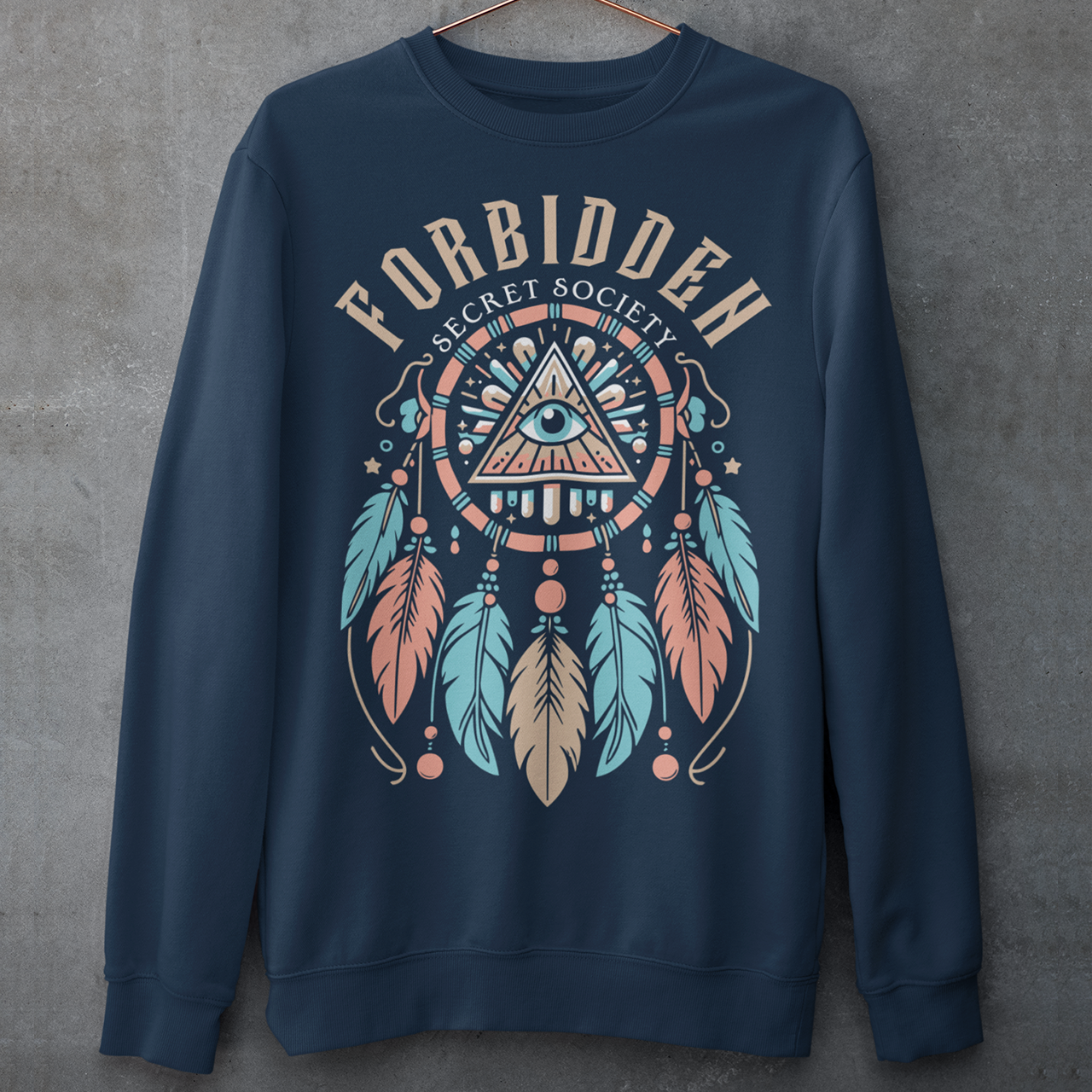 "Step into the enigmatic world of clandestine knowledge with our Illuminati Dreamcatcher sweatshirt. Featuring an intricate design that merges the mystique of the Illuminati symbol with the cultural heritage of dreamcatchers, this tee is a fusion of intrigue and symbolism. The central eye, a hallmark of Illuminati iconography, peers out from the heart of the dreamcatcher, symbolizing the pursuit of hidden truths and enlightenment.