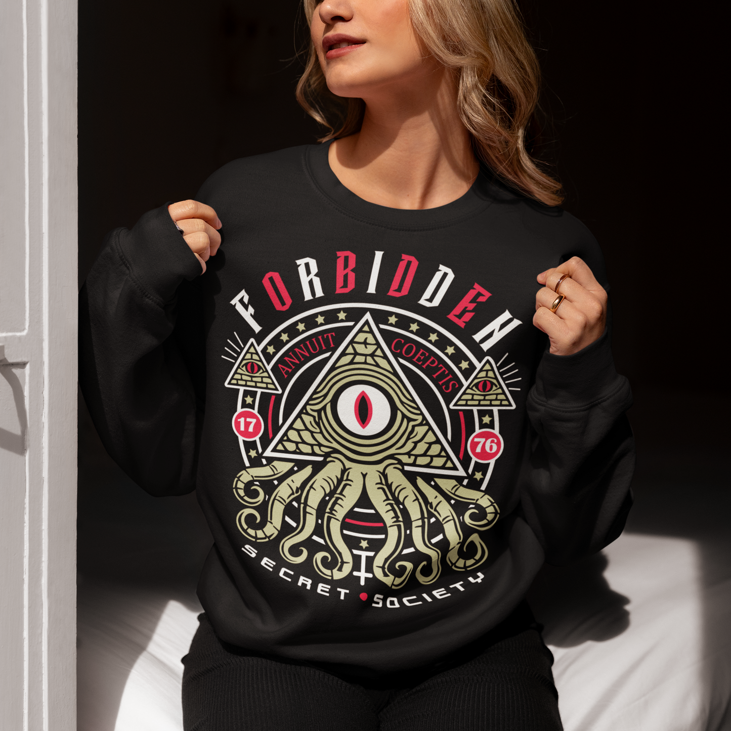 Uncover the hidden truths with this striking Forbidden Secret Society sweatshirt. Featuring a mesmerizing graphic of reptilian tentacles slithering from an all-seeing eye pyramid, this design channels the dark mystique of the Illuminati and ancient conspiracies. Bold text wraps around the image, whispering secrets the world was never meant to know. Perfect for truth seekers, conspiracy enthusiasts, or anyone who thrives in the shadows of the unknown.