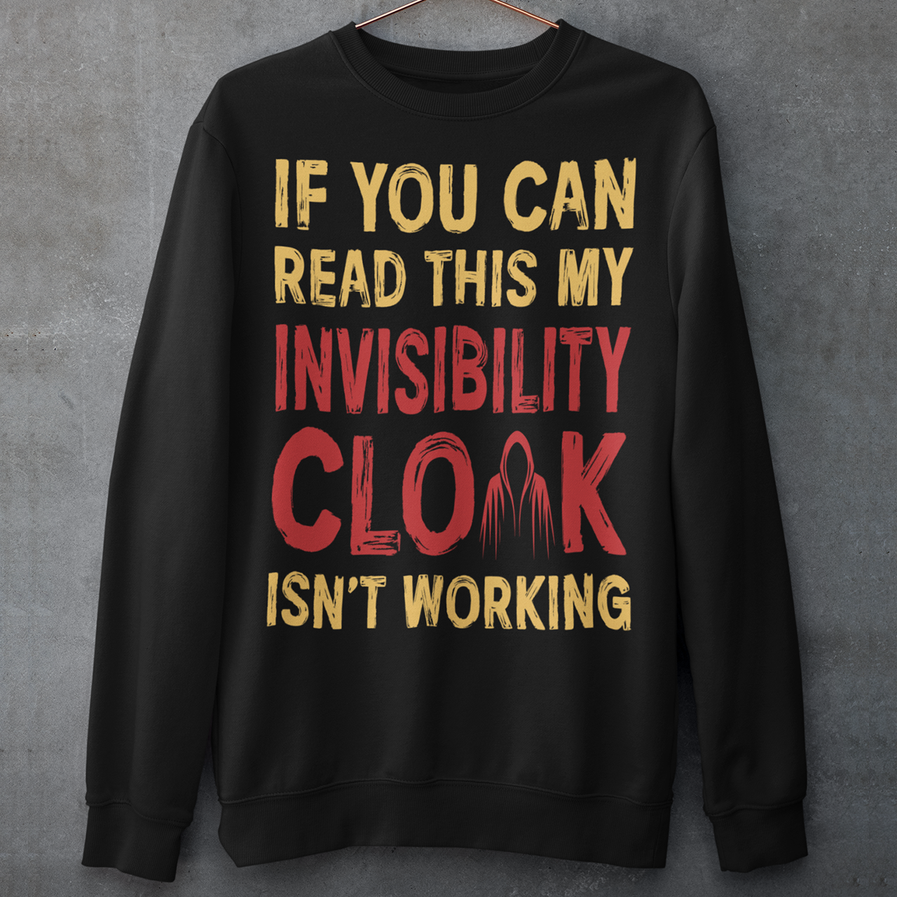 Turn heads and raise a few laughs with this clever and quirky sweatshirt! Featuring the bold text “IF YOU CAN READ THIS MY INVISIBILITY CLOAK ISN'T WORKING”, this shirt is perfect for wizards, pranksters, and introverts alike. Whether you're a fan of fantasy, sarcasm, or just enjoy flying under the radar, this shirt delivers a magical dose of humor.
