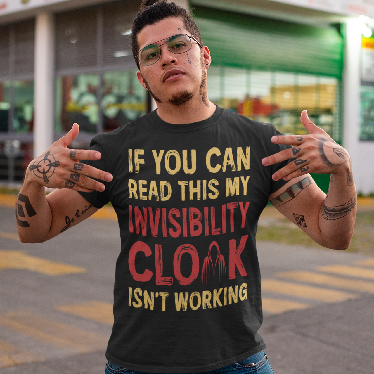 Turn heads and raise a few laughs with this clever and quirky tee! Featuring the bold text “IF YOU CAN READ THIS MY INVISIBILITY CLOAK ISN'T WORKING”, this shirt is perfect for wizards, pranksters, and introverts alike. Whether you're a fan of fantasy, sarcasm, or just enjoy flying under the radar, this shirt delivers a magical dose of humor.