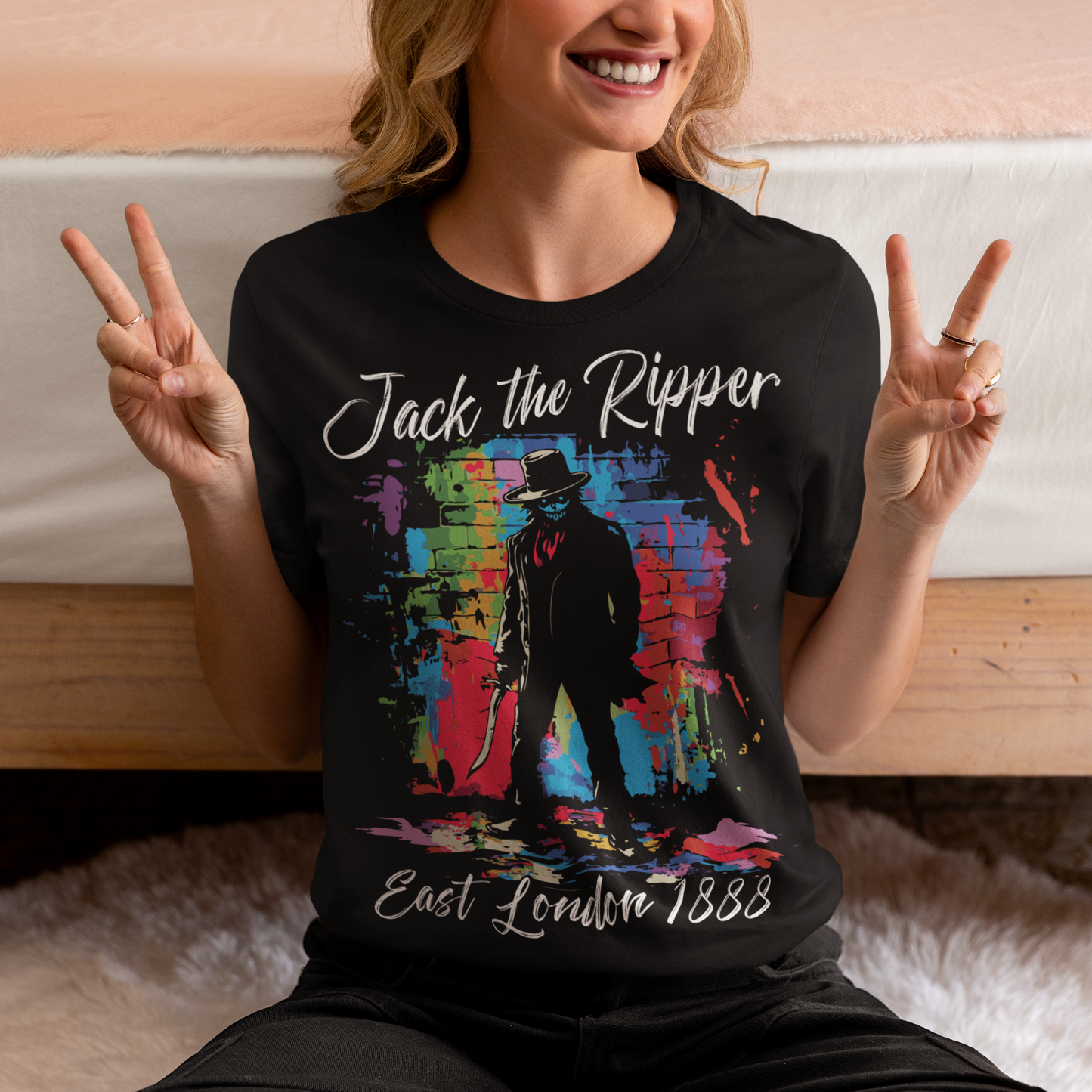 This striking T-shirt features a gritty, graffiti-inspired design of Jack the Ripper, blending urban street art with Victorian-era mystery. The graphic shows a dark, shadowy figure with subtle splatters and rough lines, capturing the chilling essence of London's most notorious figure. Graffiti text above reads "Jack the Ripper," while below, "East London 1888" adds an authentic touch, grounding the design in its historical setting.