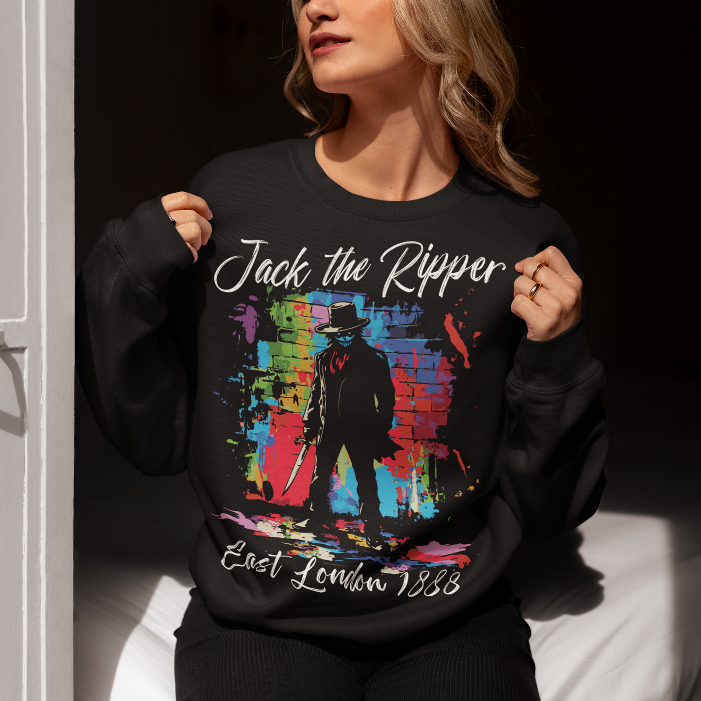 Black sweatshirt of a graffiti Jack the Ripper design with text above "Jack the Ripper" and text below "East London 1888".