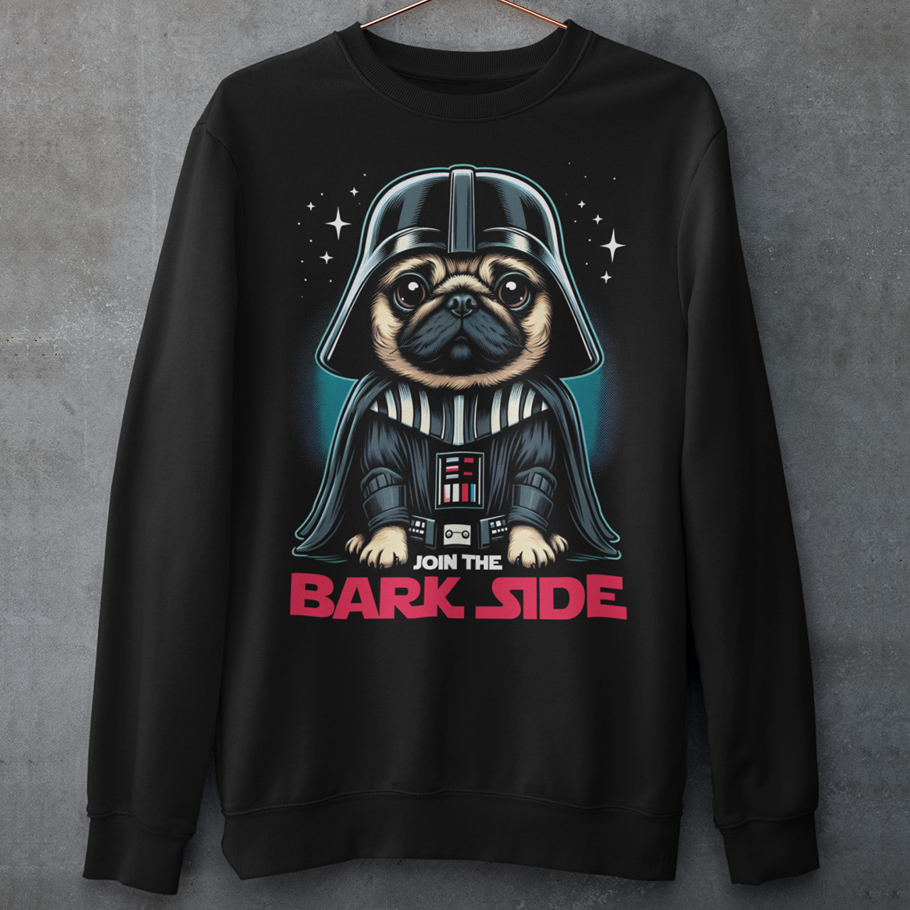 Introducing the ultimate "Join the Bark Side" Sweatshirt. This playful design features an adorable pug dressed as a Sith Lord and a determined, yet undeniably cute, expression. The pug's wrinkled face and intense stare will make anyone smile, as he embodies the dark side in the most charming way possible. Beneath the pug, bold text reads "JOIN THE BARK SIDE," adding a humorous twist to the classic phrase. This shirt is sure to be a hit for those with a love for pups and galactic adventures!