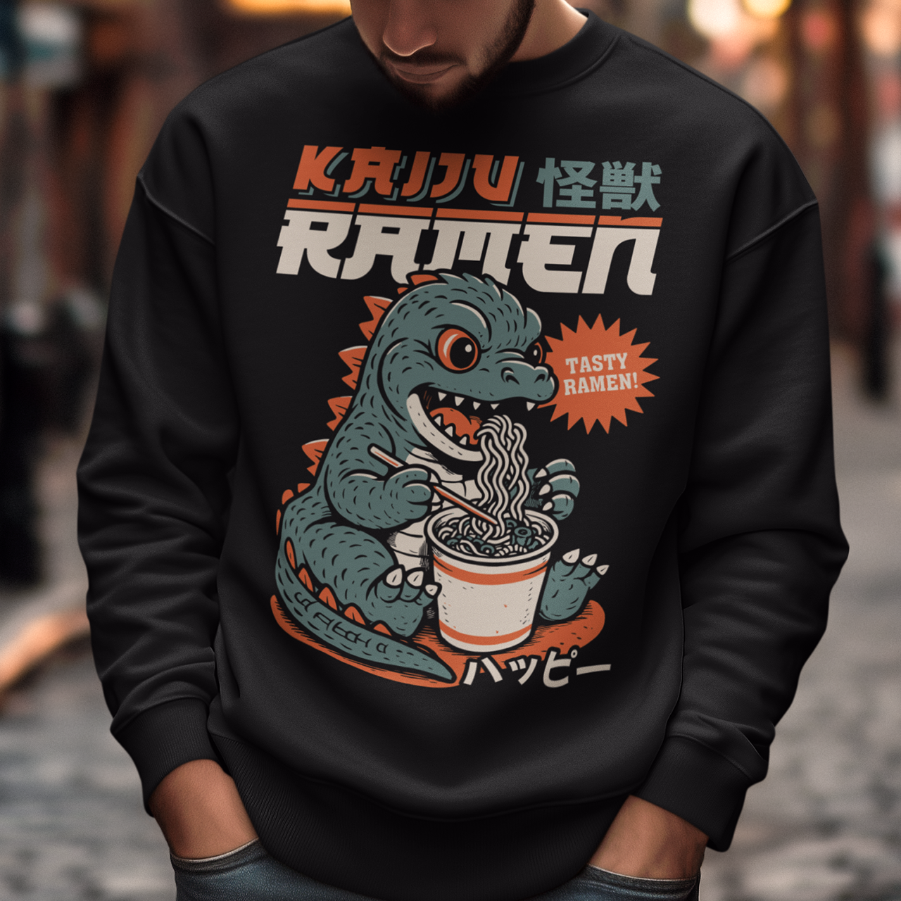 This epic sweatshirt features a towering Japanese monster (Kaiju) mid-slurp, devouring a massive bowl of ramen with wild abandon. With chopsticks in claw and noodles flying, it’s the ultimate mashup of monstrous hunger and culinary chaos. Bold text above reads KAIJU RAMEN, bringing Tokyo street-style energy to your wardrobe.