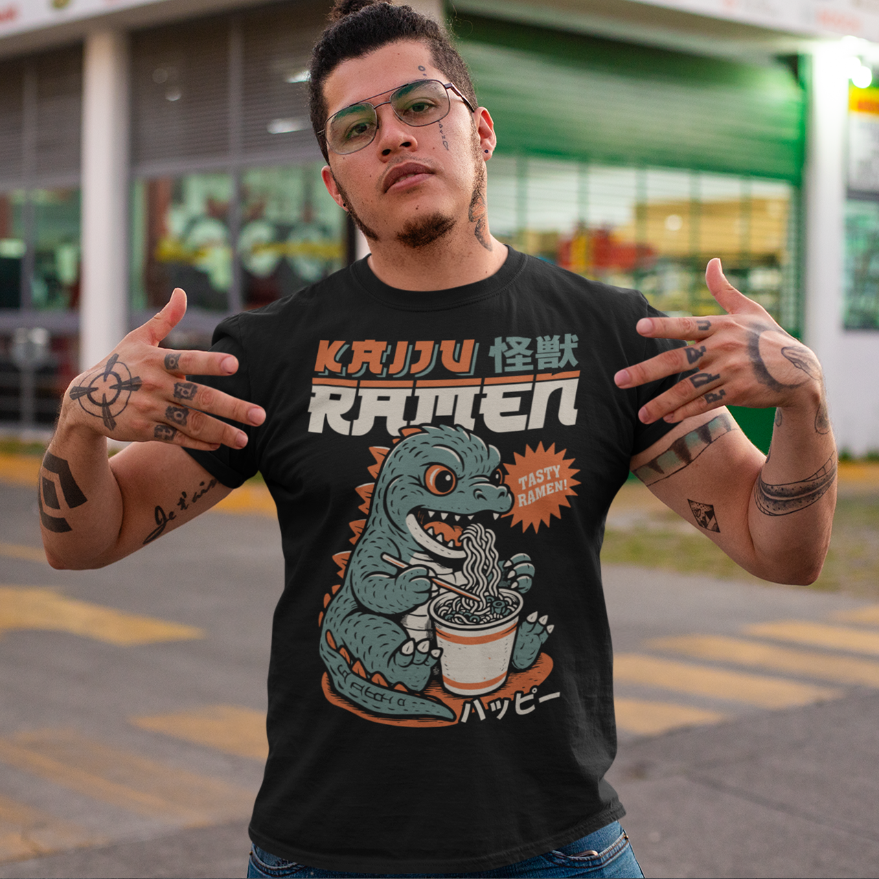 This epic tee features a towering Japanese monster (Kaiju) mid-slurp, devouring a massive bowl of ramen with wild abandon. With chopsticks in claw and noodles flying, it’s the ultimate mashup of monstrous hunger and culinary chaos. Bold text above reads KAIJU RAMEN, bringing Tokyo street-style energy to your wardrobe.