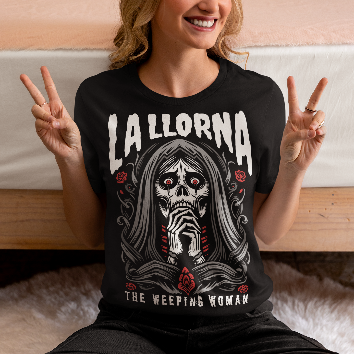 This striking La Llorona t-shirt features a haunting depiction of the legendary Weeping Woman, her ghostly figure shrouded in mist, with flowing hair and a sorrowful expression as she searches for her lost children. The design captures the eerie, chilling essence of the famous Latin American folktale, blending dark, gothic tones with an ethereal glow. Above the image, bold lettering reads "LA LLORONA", while below, the translation "THE WEEPING WOMAN" adds to the eerie mystique. Perfect for fans of folklore